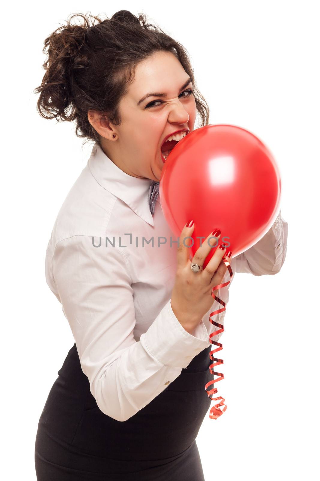 confident woman playing with balloon on white background