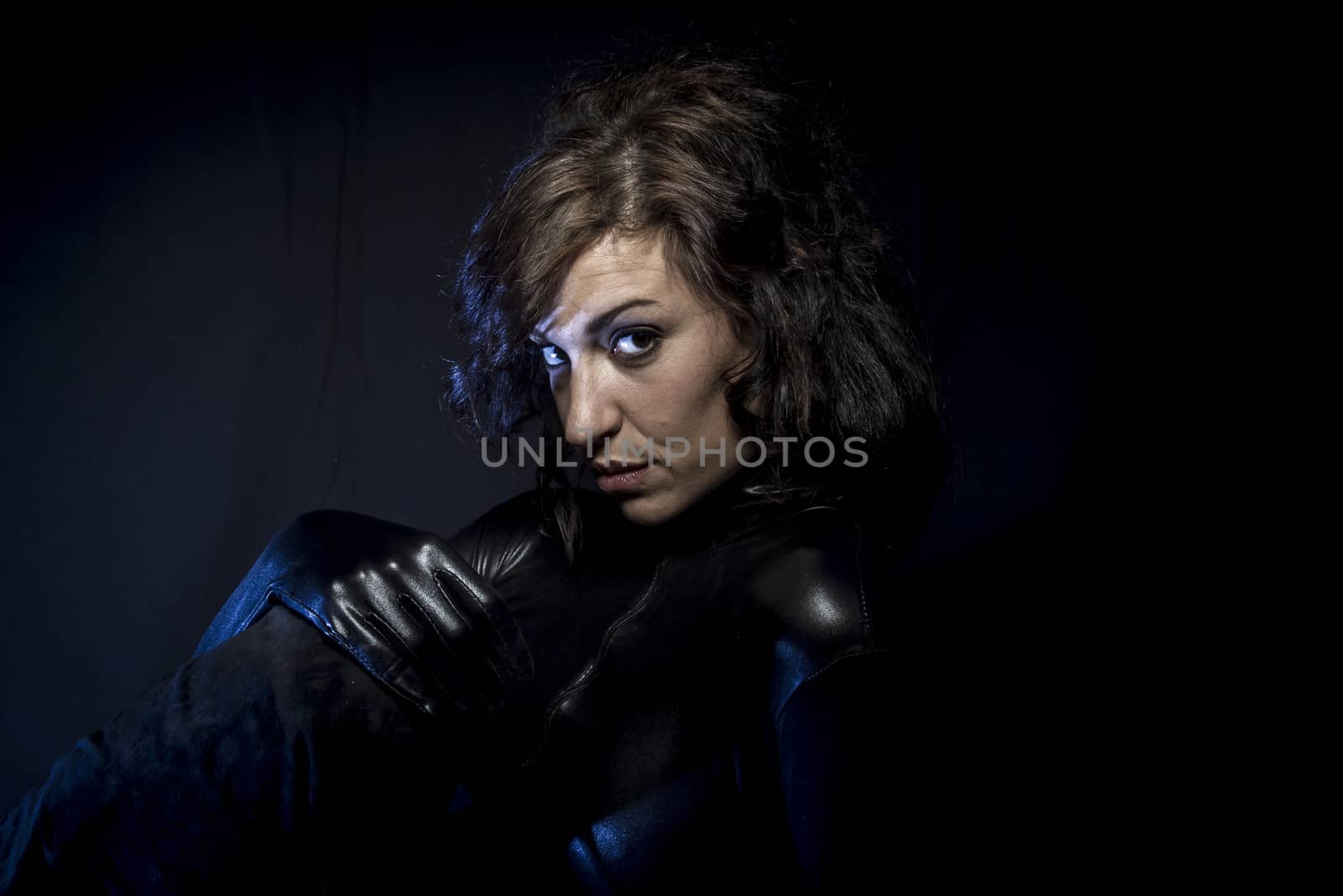 Sexy brunette in black latex costume, Fashion shot of a woman in by FernandoCortes