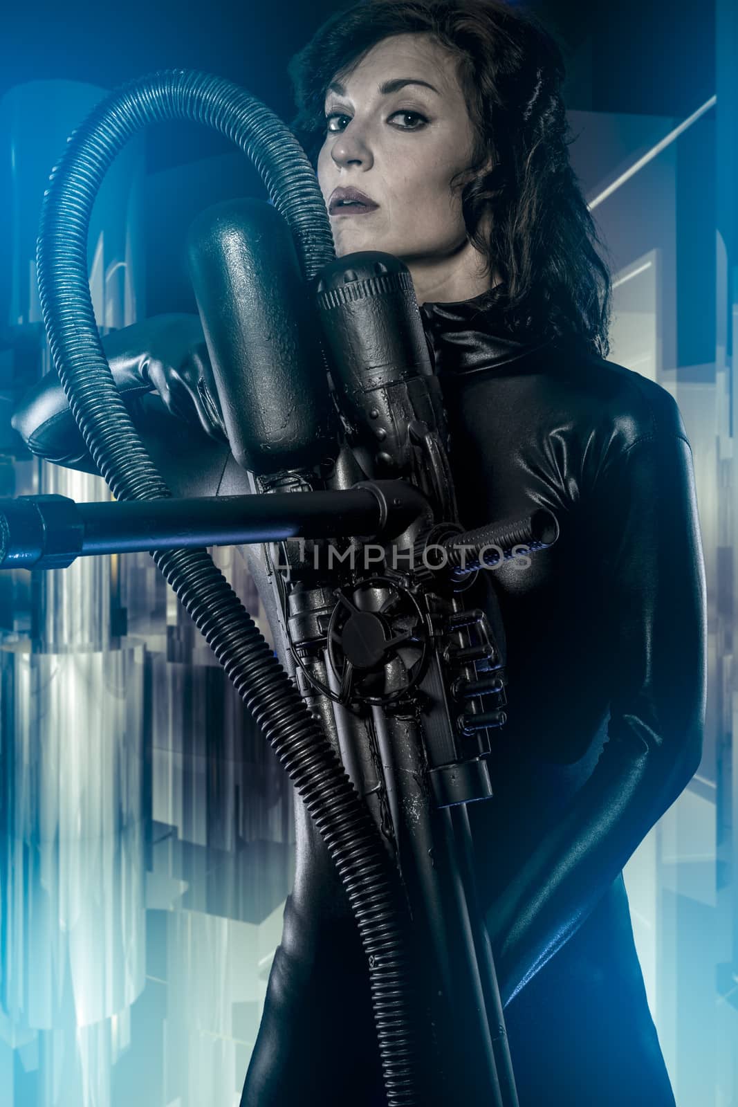Space, armed woman in a garage, future concept, black latex with neon lights