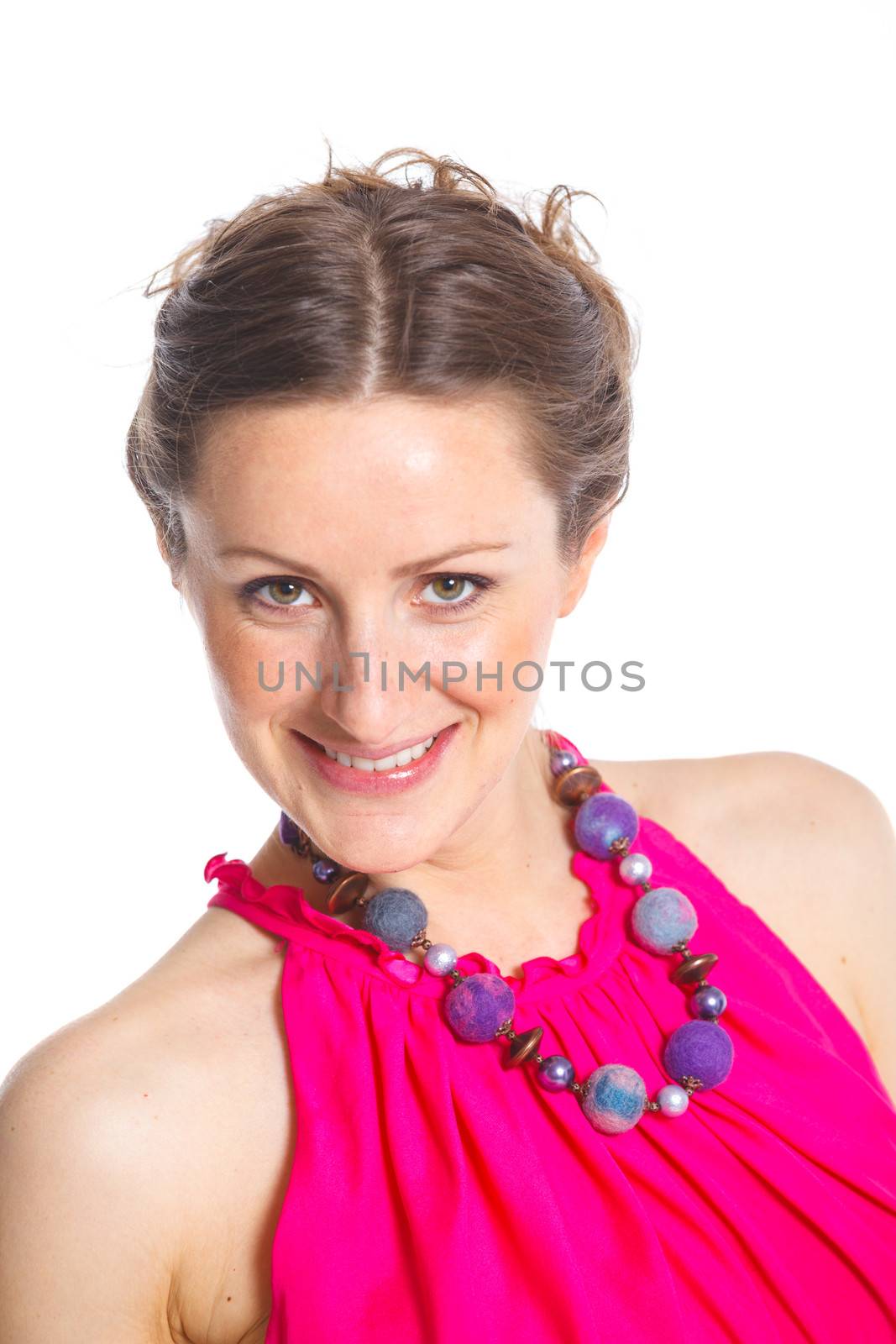 Portrait of cute female fashion model posing in pink dress. Isolated on white, studio shot