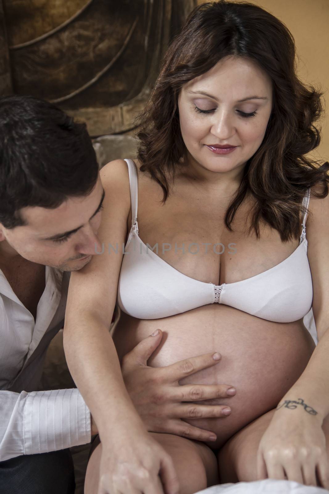 Father expecting, Family With Pregnant Mother Relaxing On bed Together