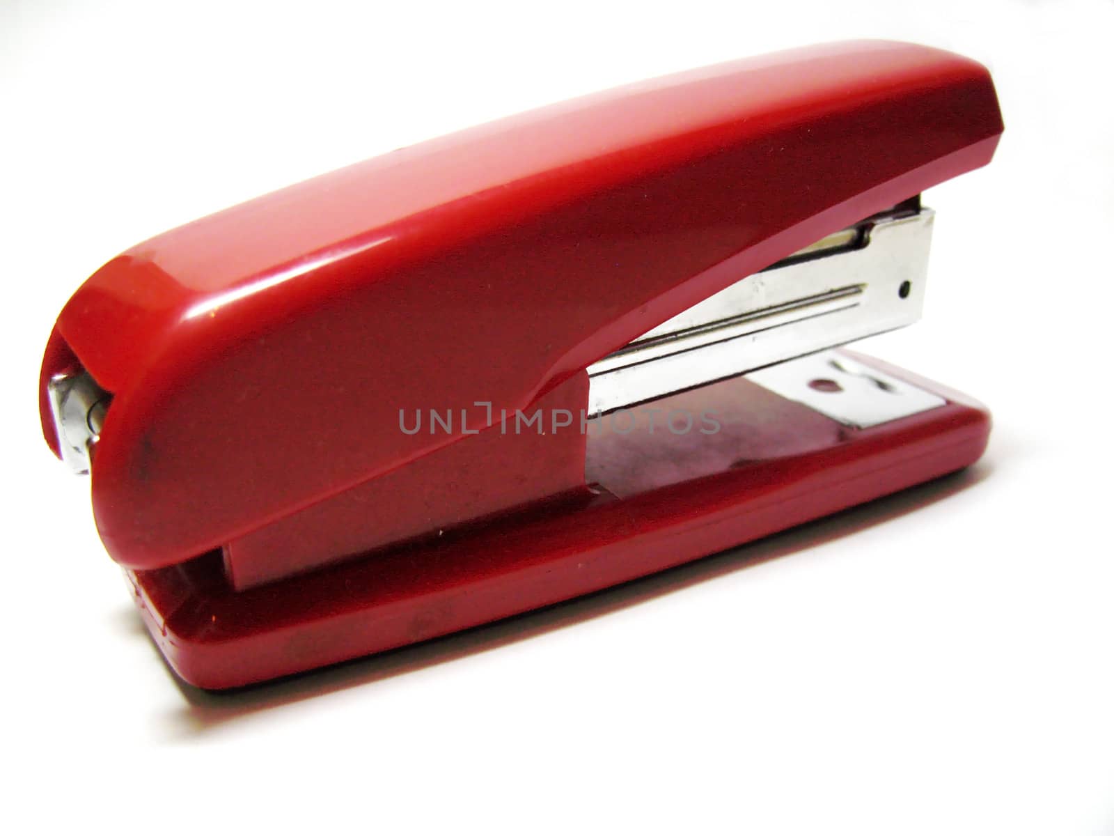 Red stapler isolated on the white background