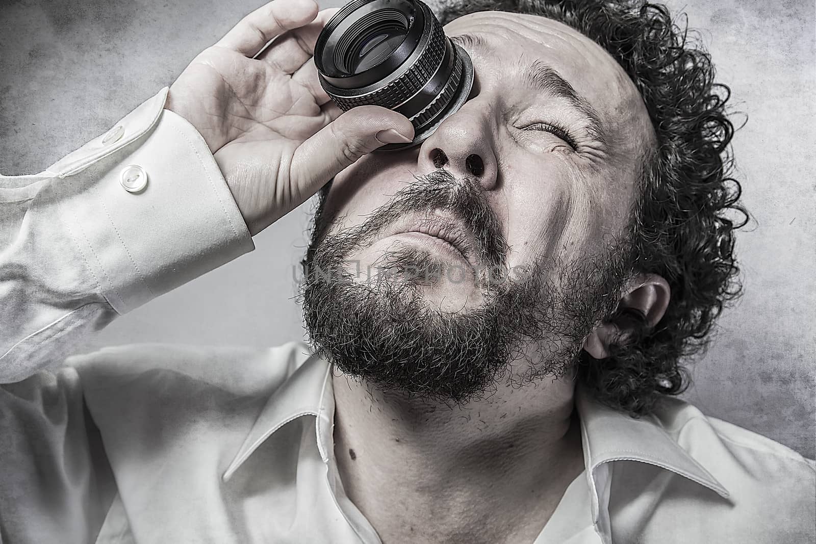 Businessman looking through a lens, man in white shirt with funn by FernandoCortes