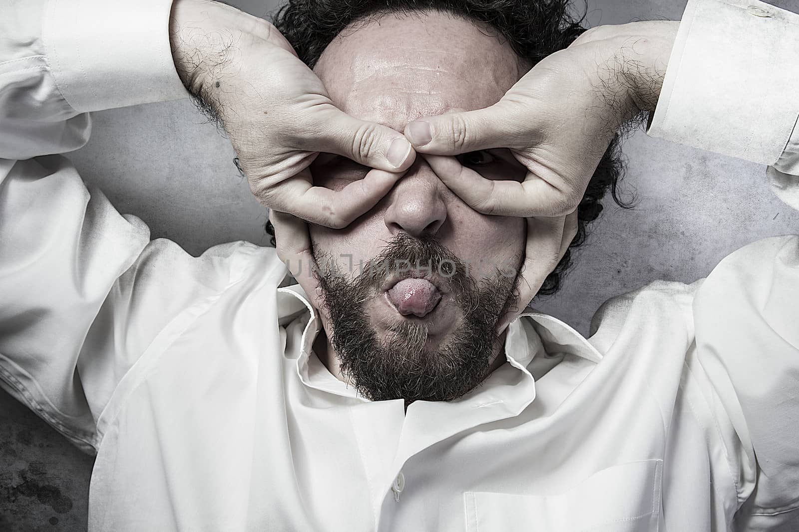 hands as a mask, man in white shirt with funny expressions