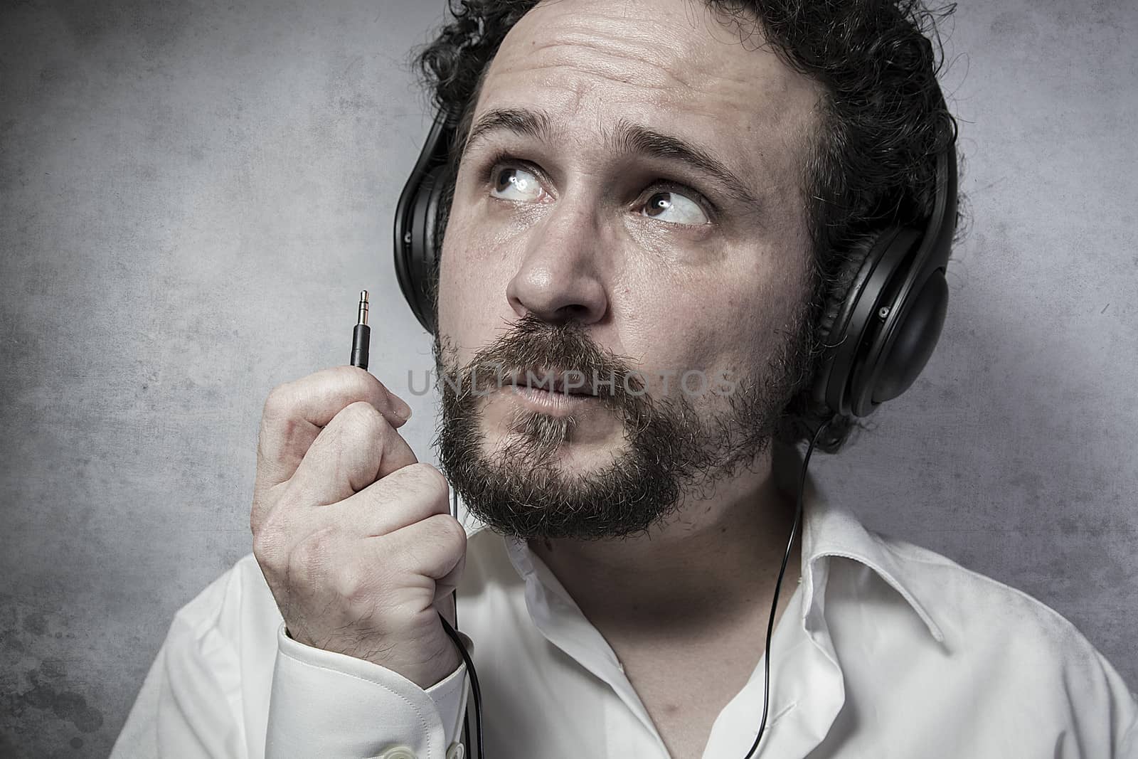 Jack, listening and enjoying music with headphones, man in white by FernandoCortes