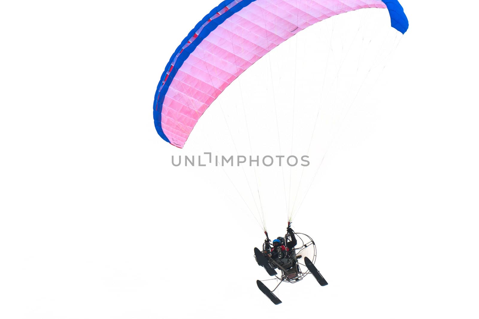 paraglider with two people in flight