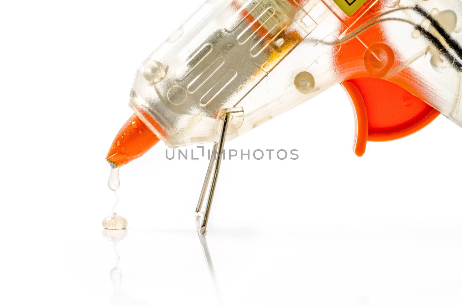 Hot glue gun isolated on white. by 9george