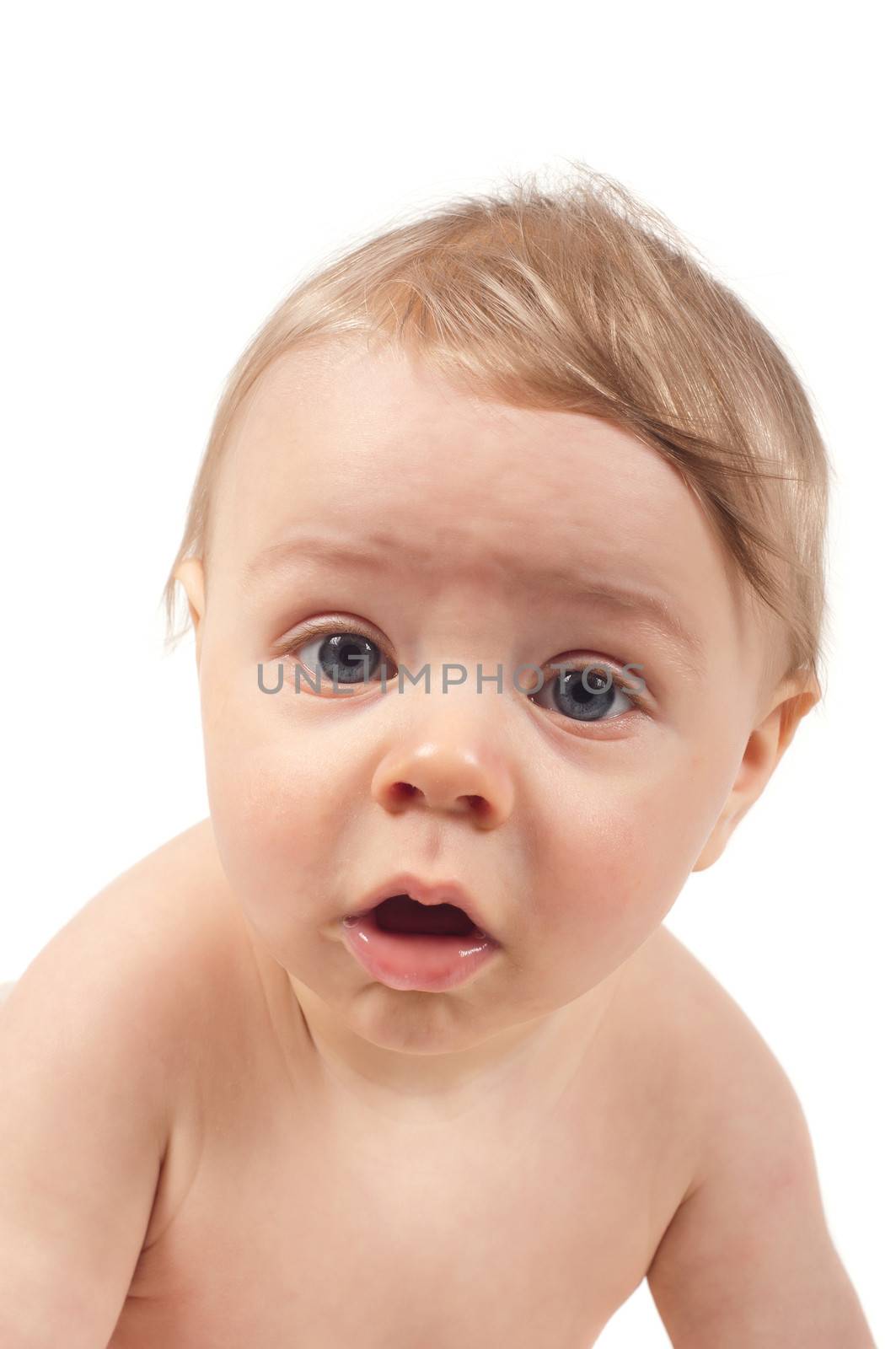 Serious baby watching in camera, isolated on white