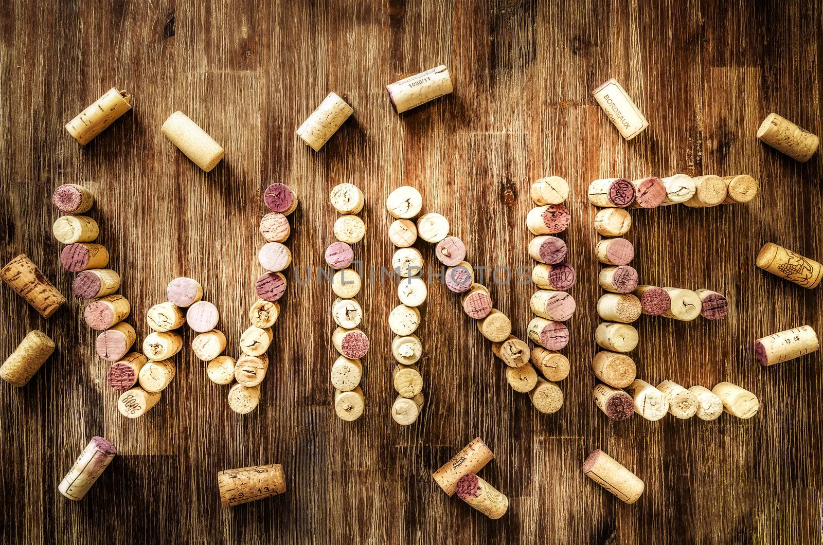 Sign wine made from corks on old wooden vintage table