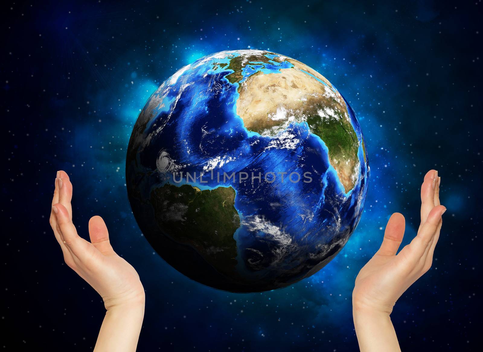 Hands holding earth. Starry sky in the background