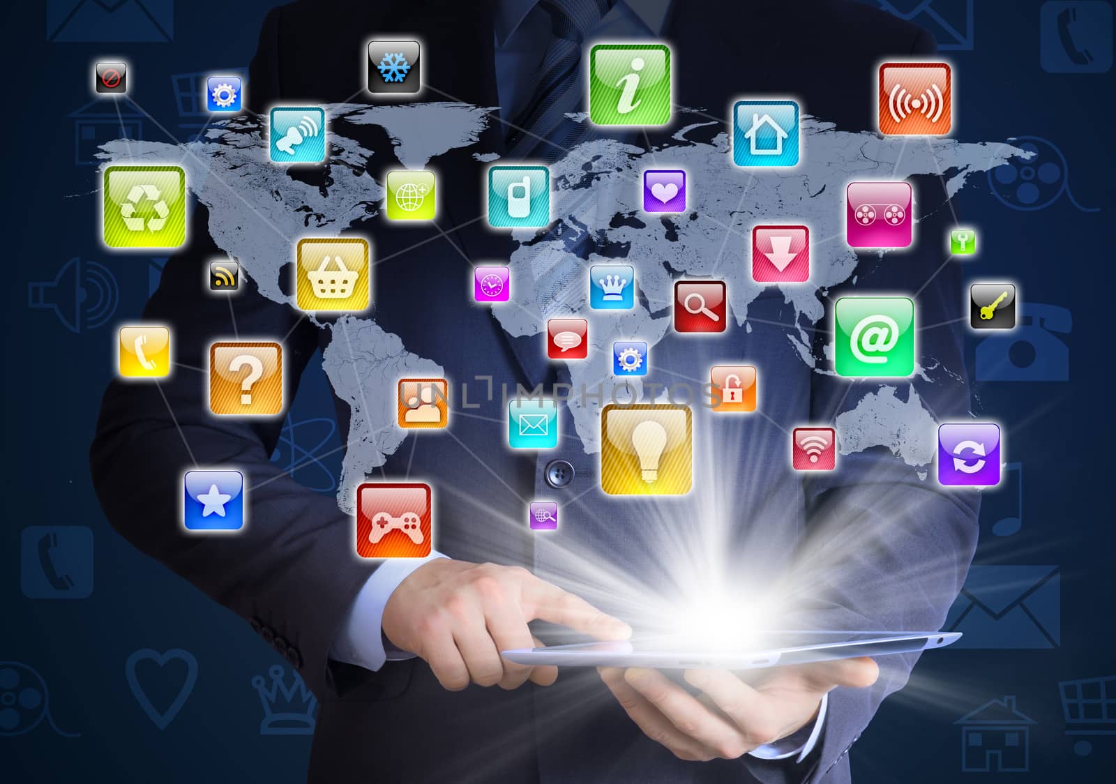 Man in suit holding tablet pc and application icons in hand. The concept of software