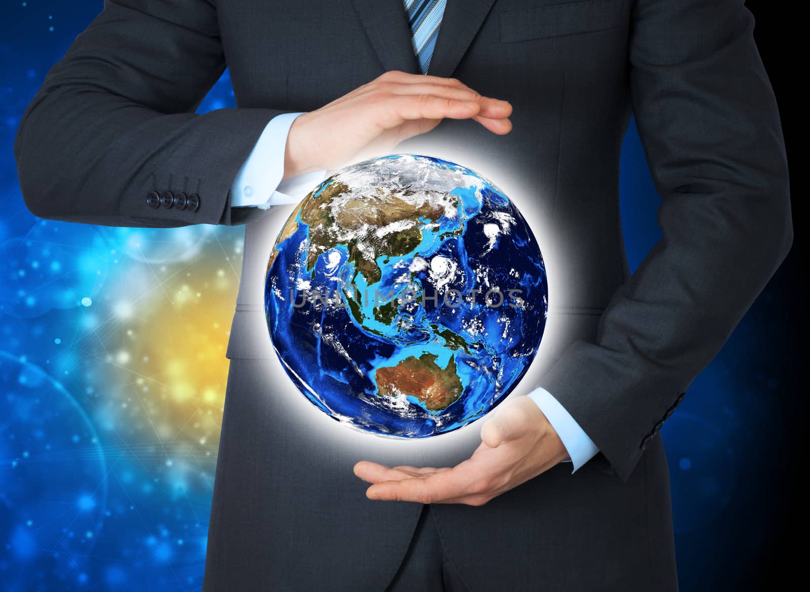 Man in suit holding a earth in hand. The concept of globalization