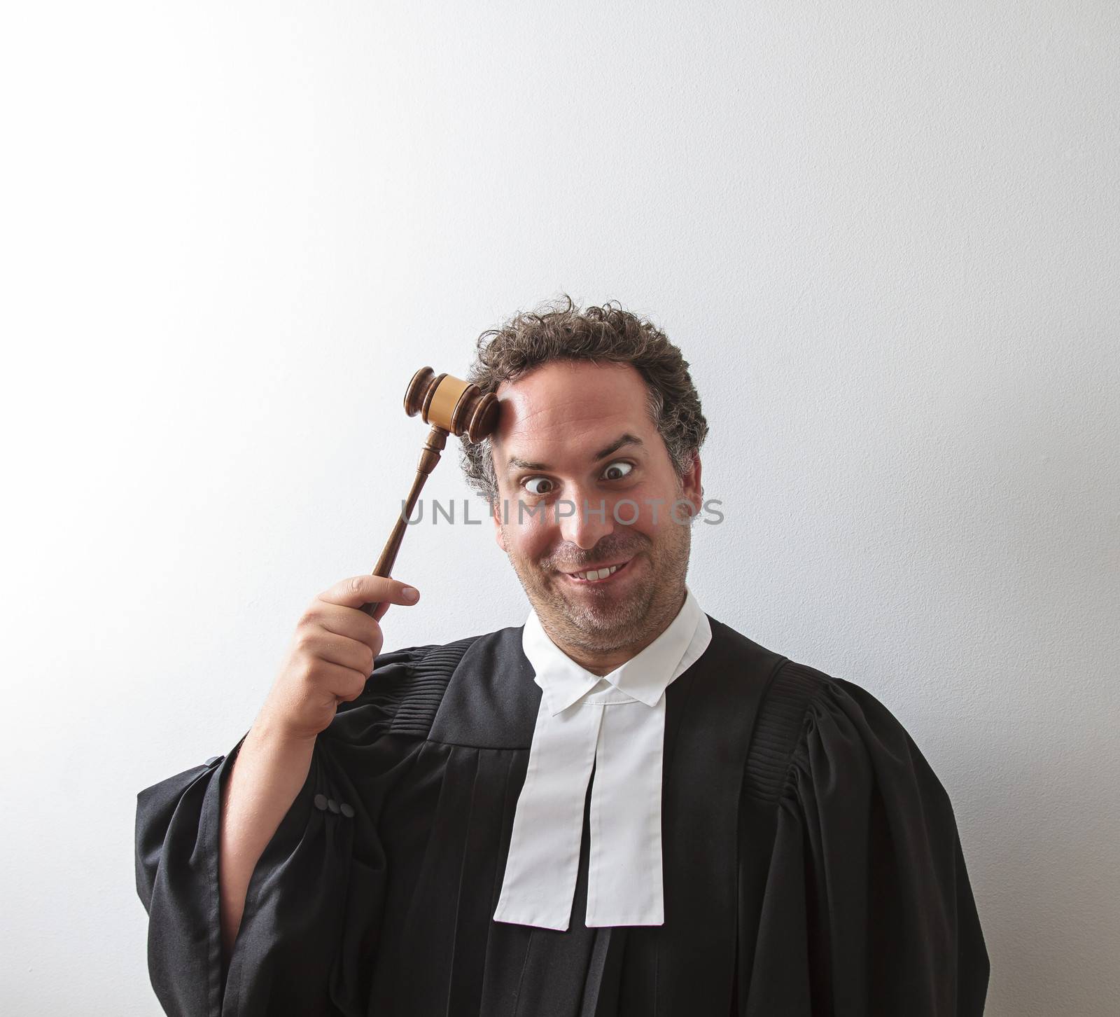 canadian attorney clowning around and banging the gavel on his head