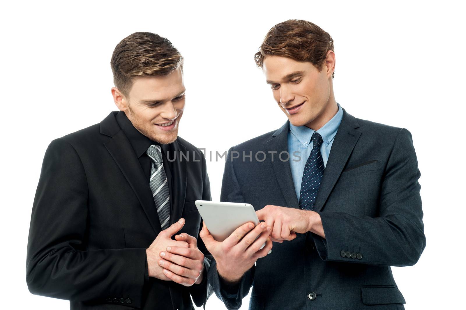 Smiling young businessmen using tablet pc device