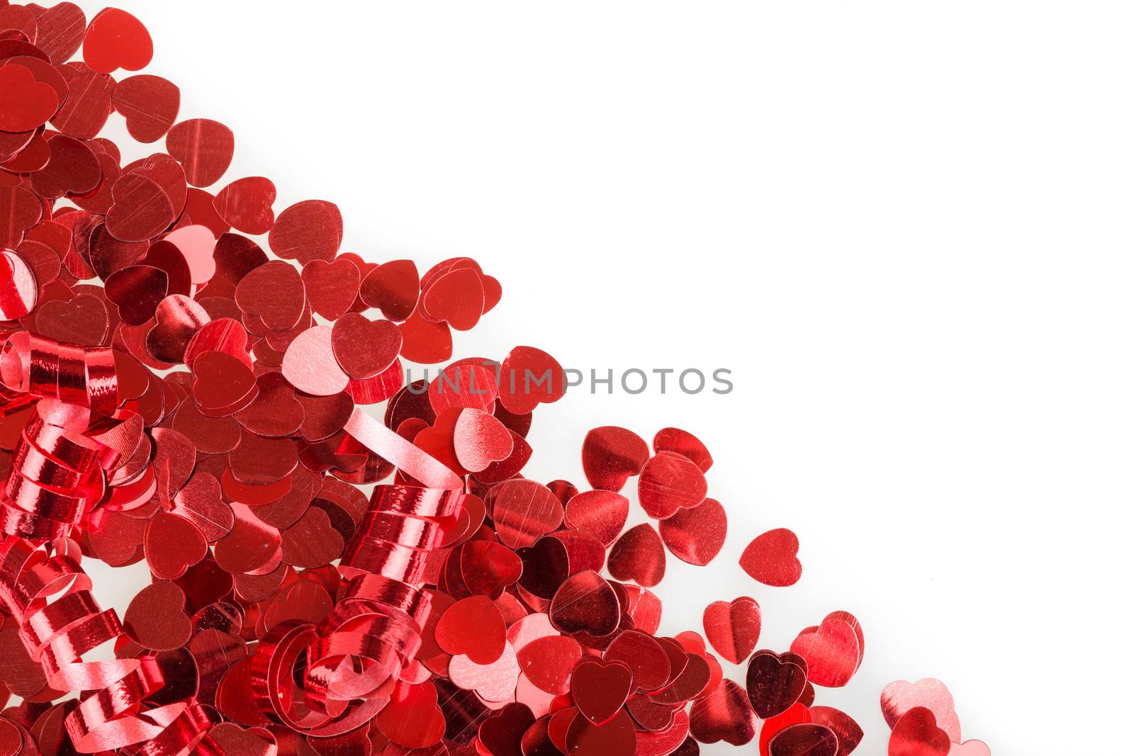 small red hearts confetti isolated on white background