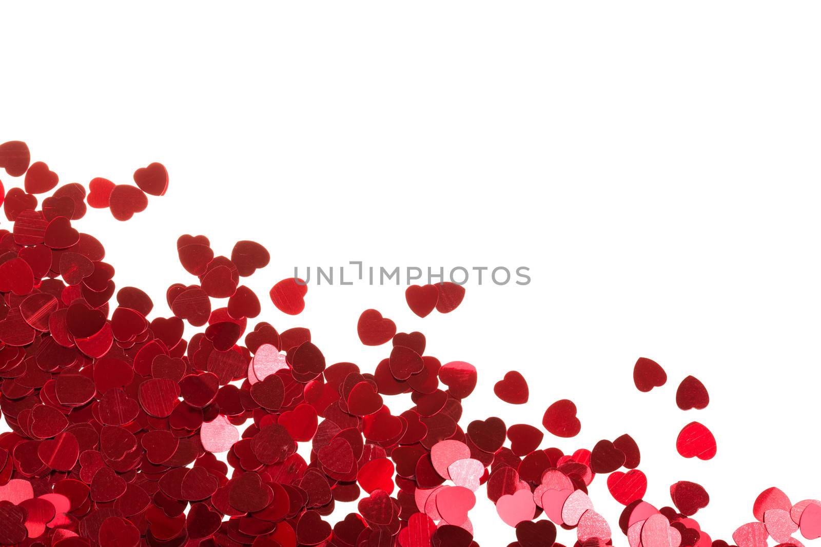 small red hearts confetti isolated on white background