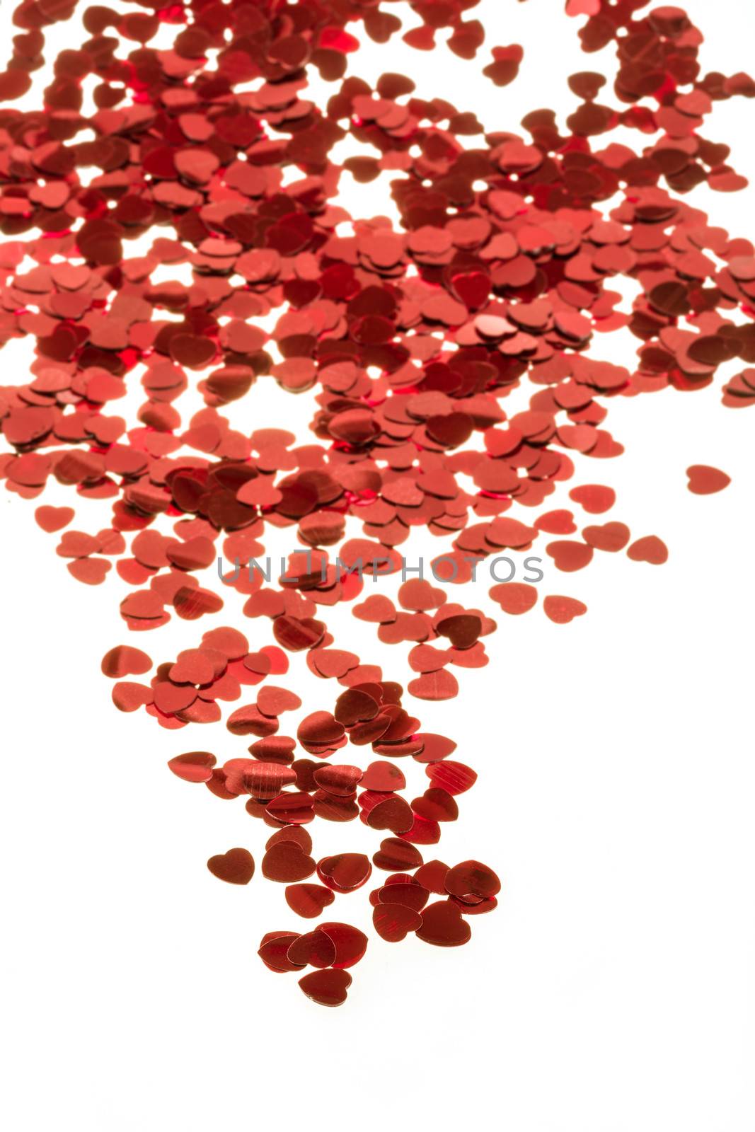 small red hearts confetti isolated on white background