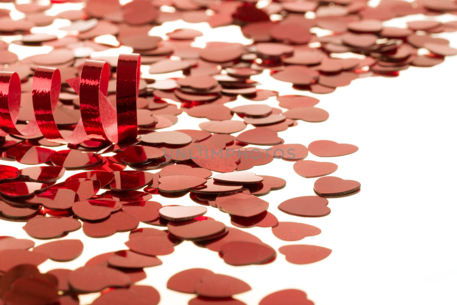 small red hearts confetti isolated on white background