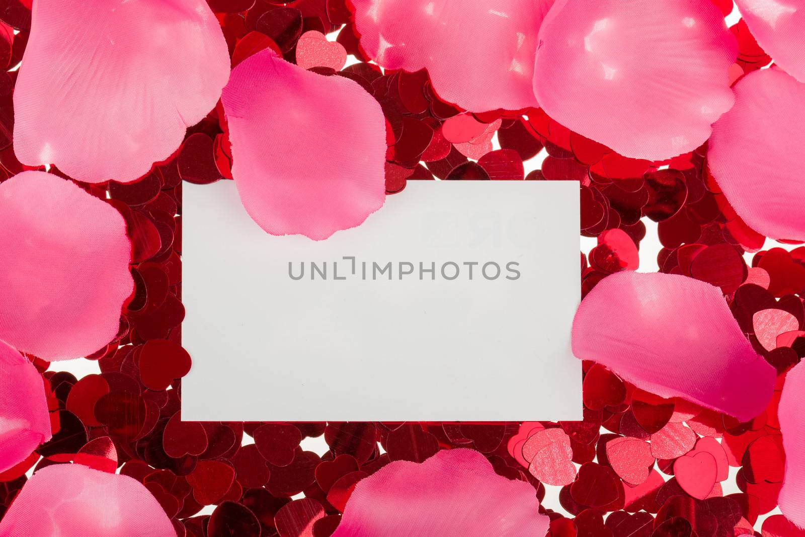 small red confetti and emty card for valentine love message