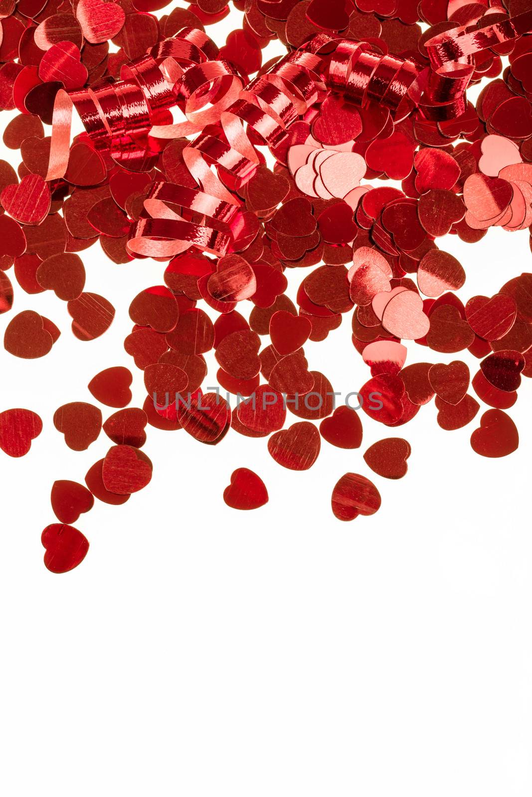 small red hearts confetti isolated on white background