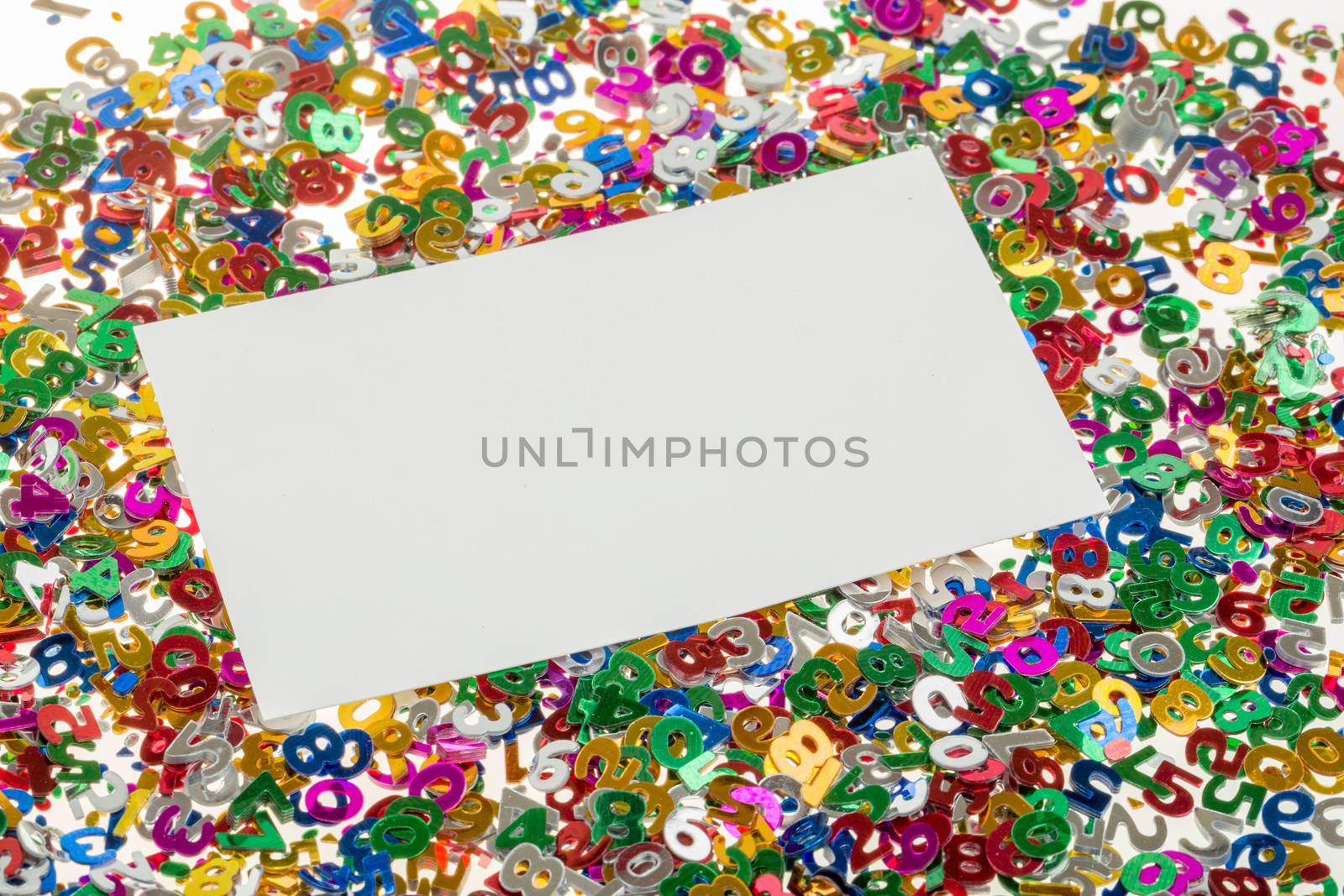 close up of small color numbers confetti and empty card