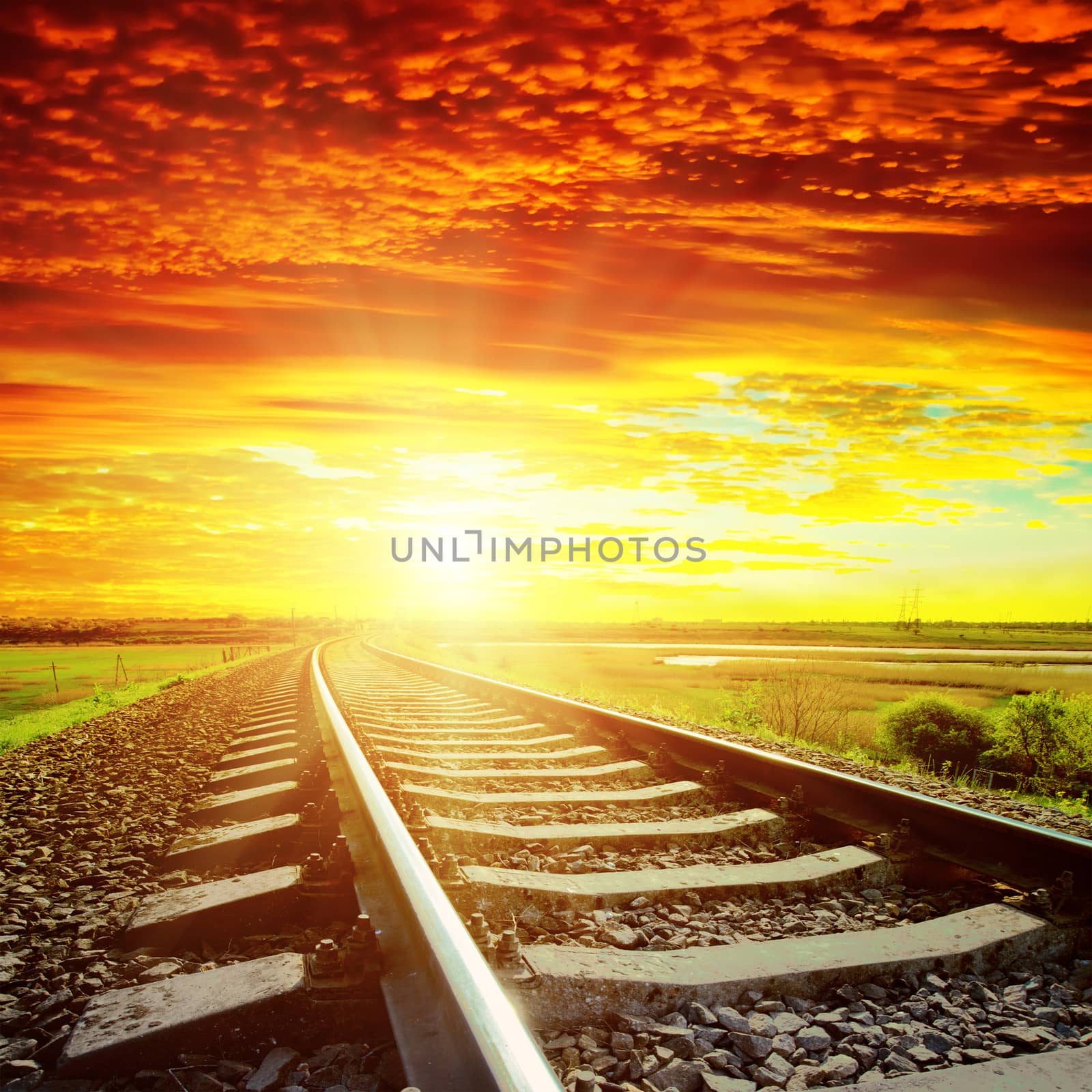 sunset with red clouds and railroad to horizon by mycola