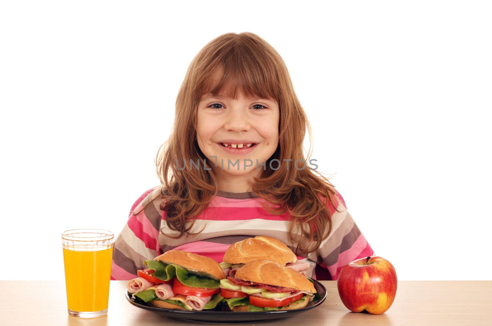 happy little girl with sandwiches apple and juice by goce