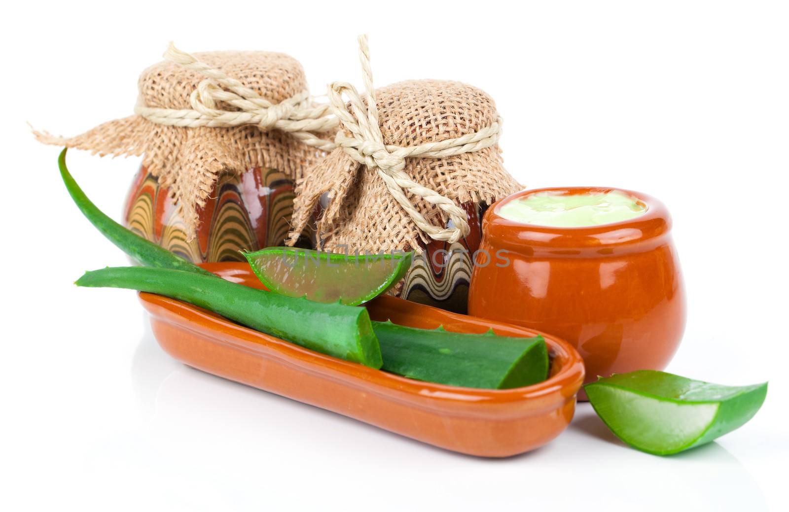 aloe-vera plant with cream, isolated on white background