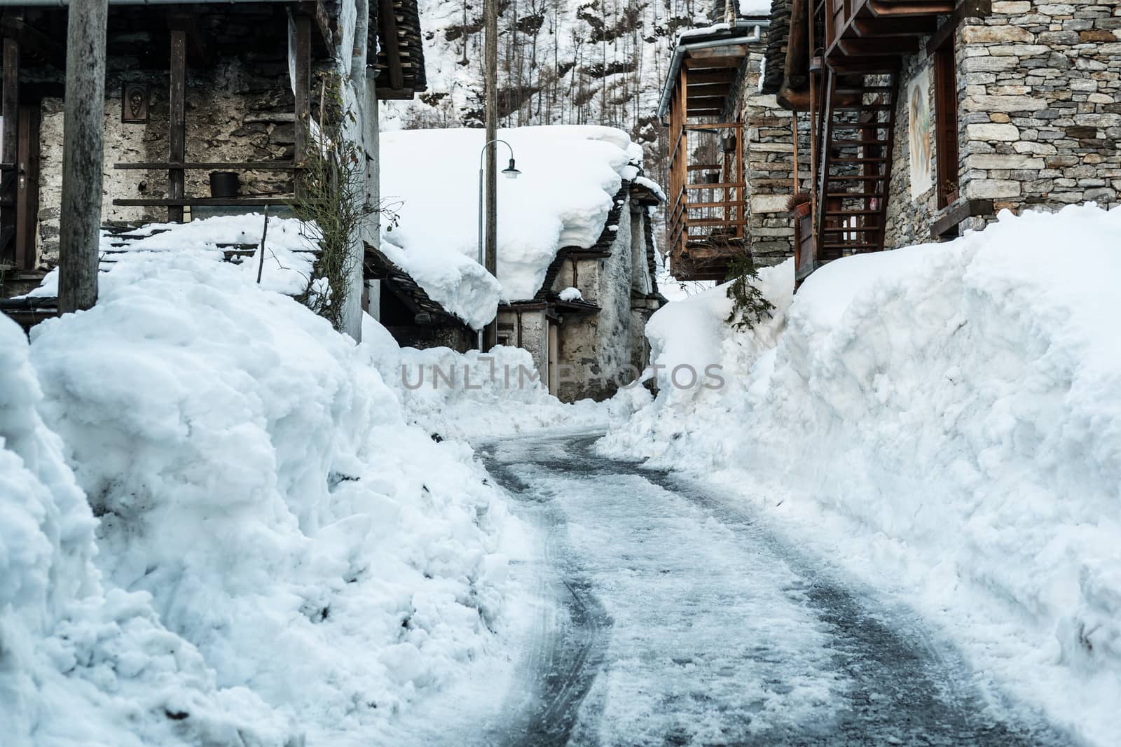 Snowy street in old village of Sonogno - Switzerland