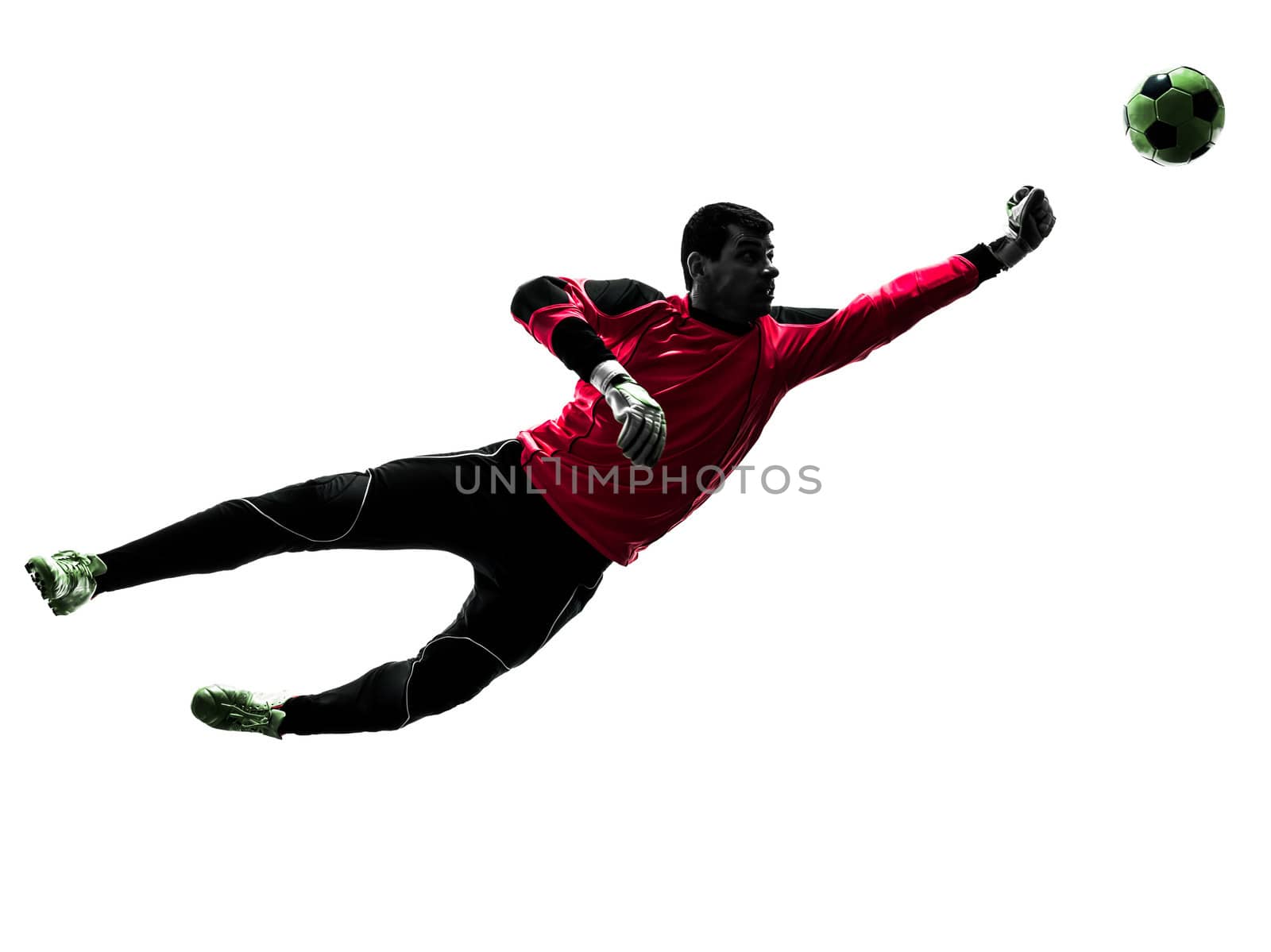 one caucasian soccer player goalkeeper man punching ball in silhouette isolated white background