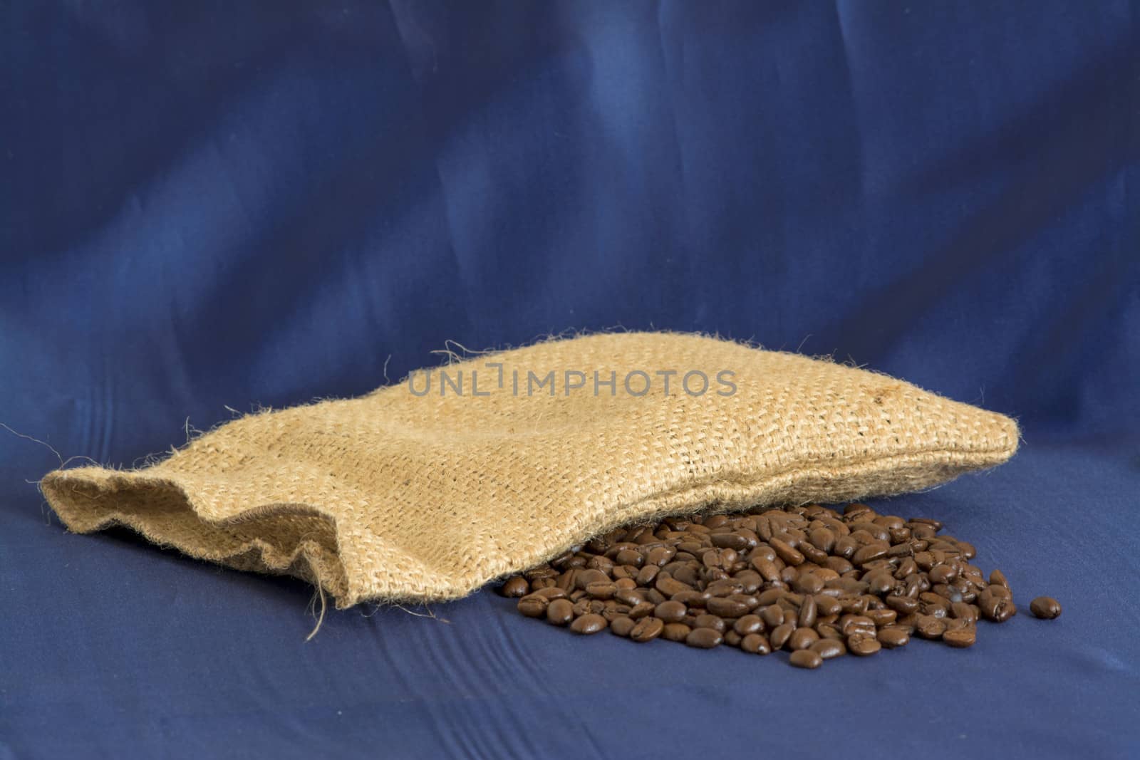 Coffee bag and beans with blue background