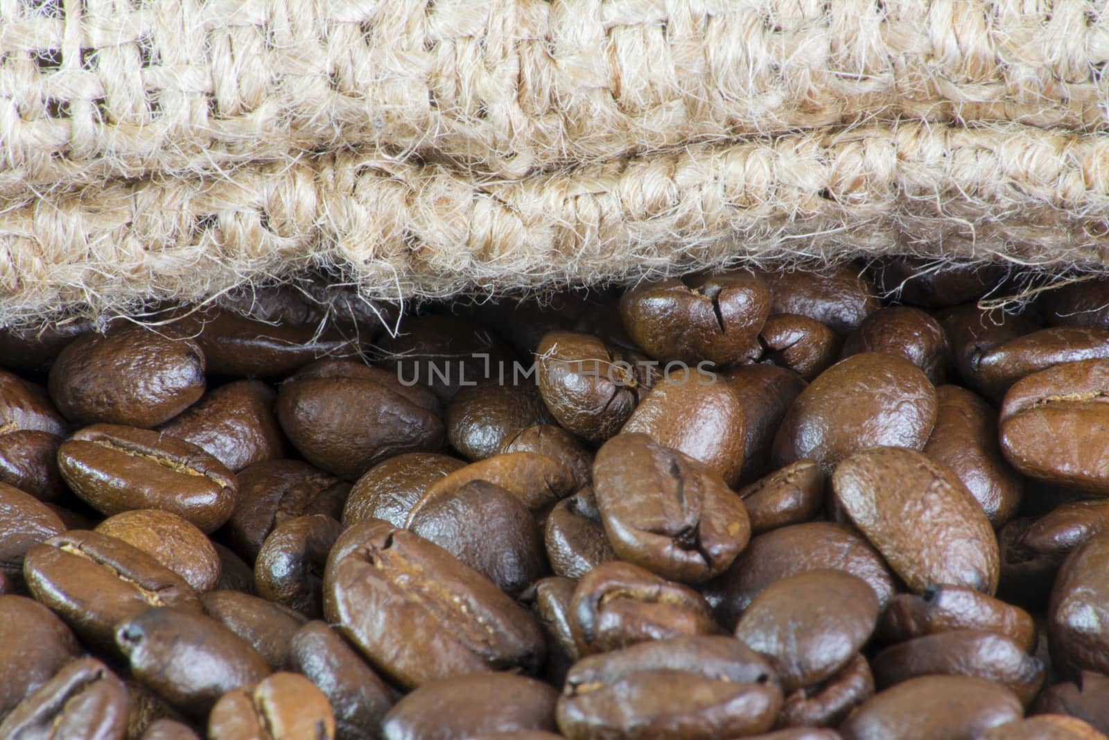 Details of coffee beans and jute bag texture