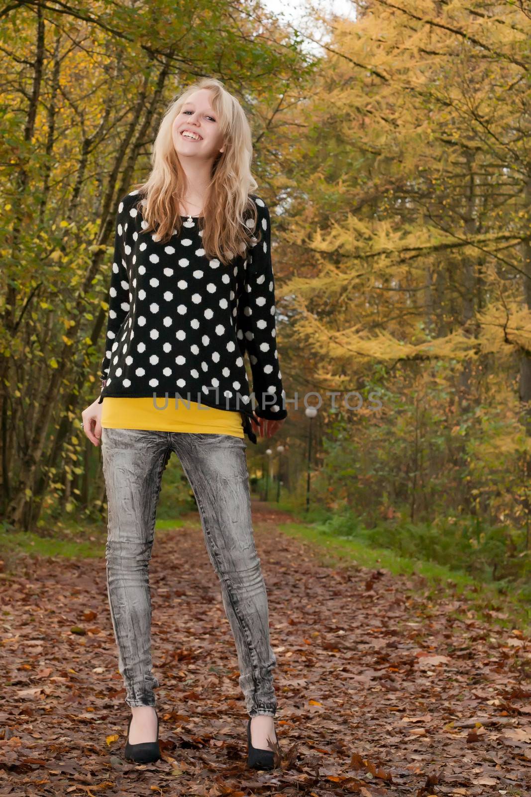 Blond smiling teen in the autumn by DNFStyle