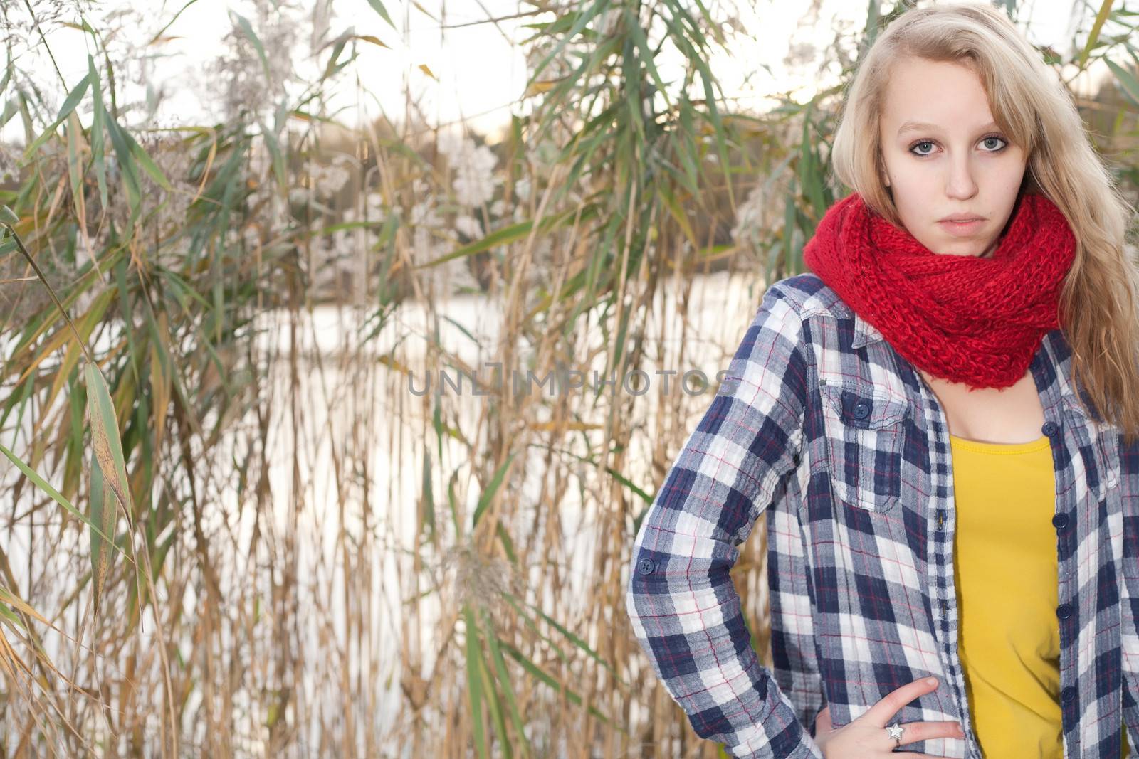 Teen in front of a lake by DNFStyle