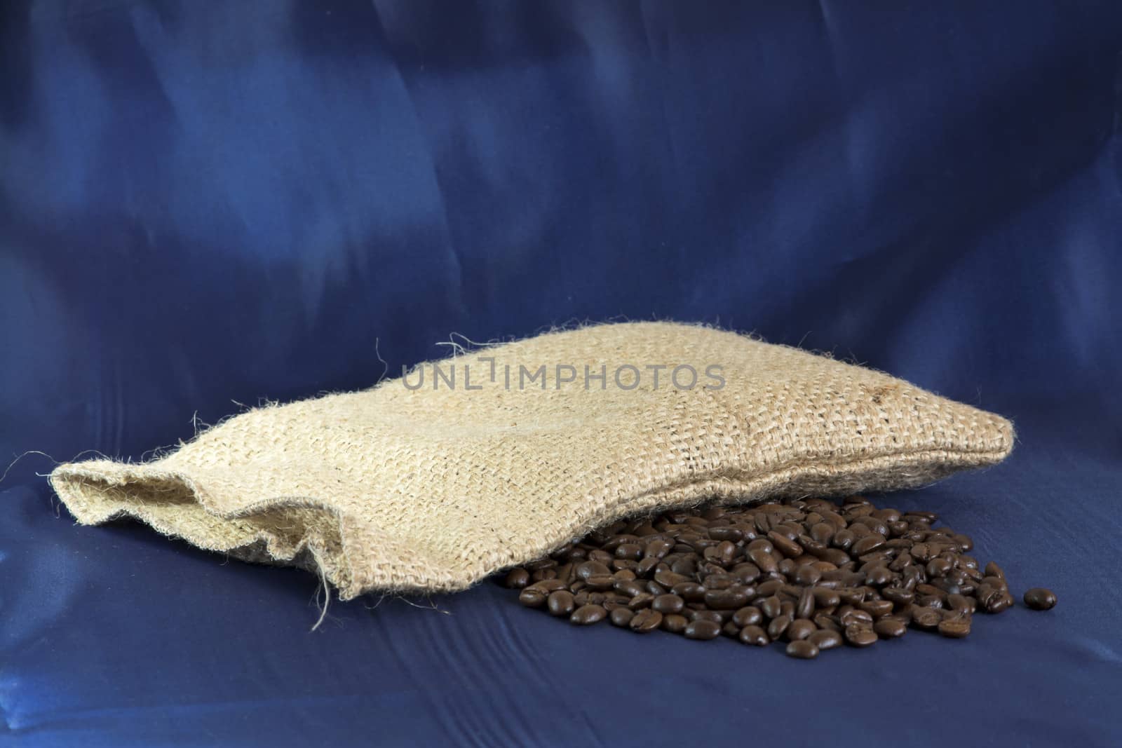 Coffee bag and beans with blue background