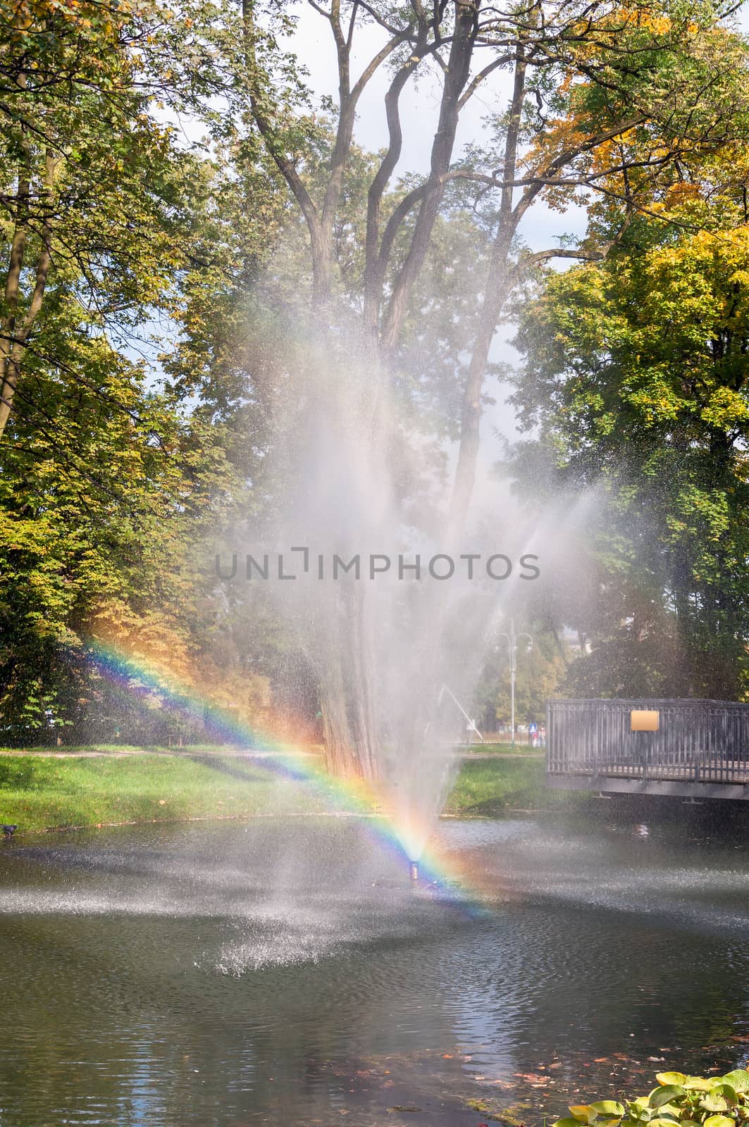 Fountain with rainbow in the park of Czestochowa, Poland