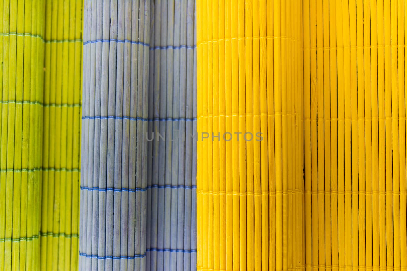 Tablecloths folders three different colors with a textured wooden branches