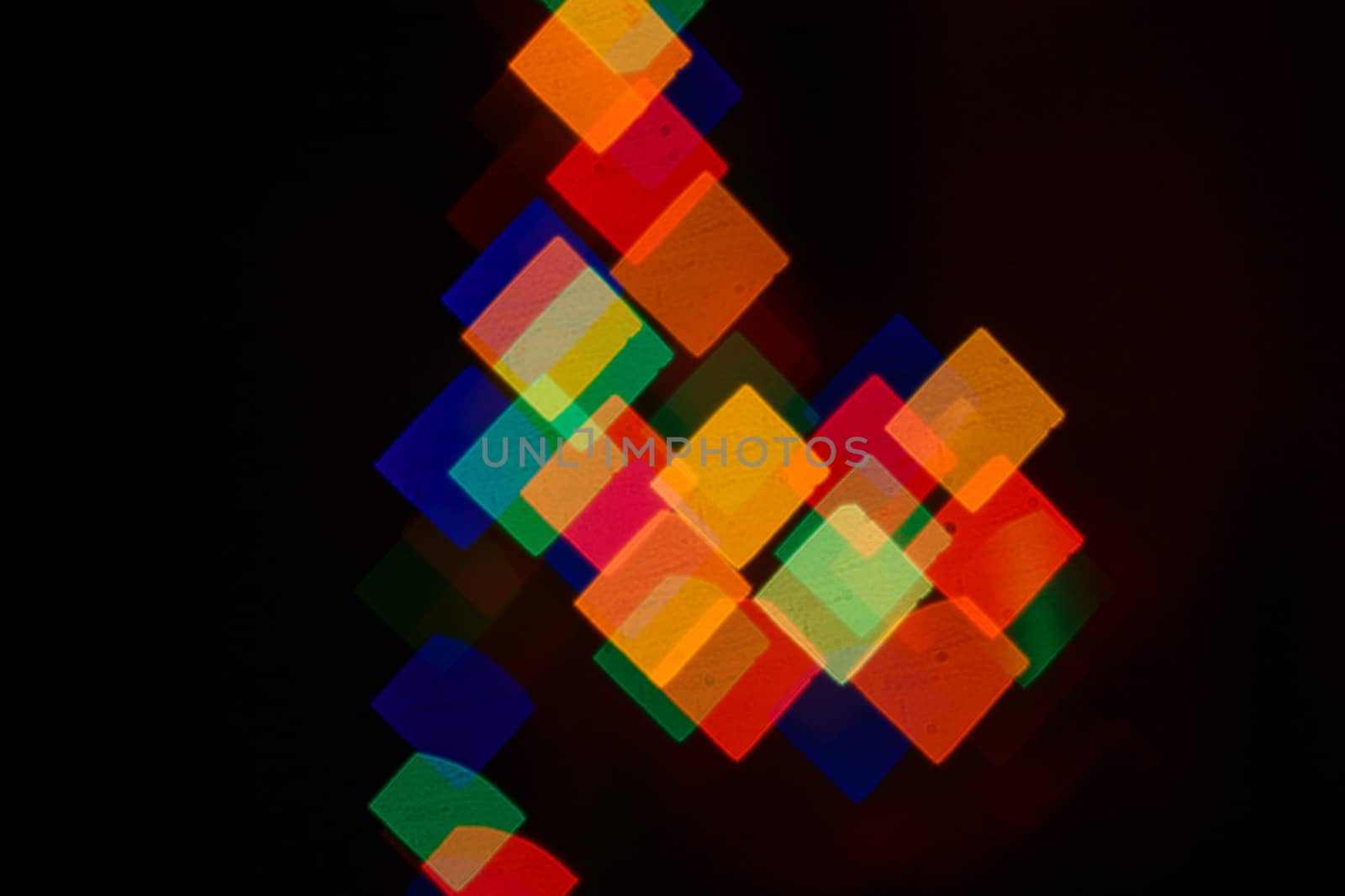 Abstract bokeh background in the form of squares on the night street