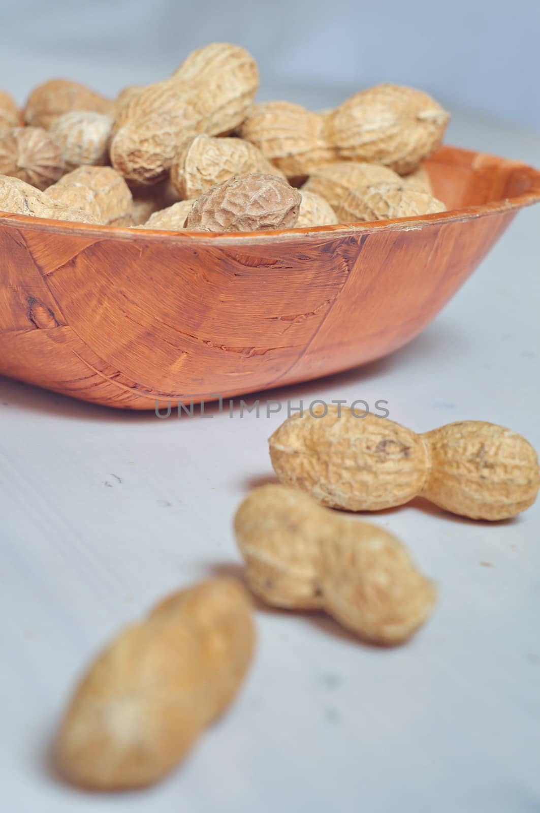 Peanuts in a brown bowl by anderm