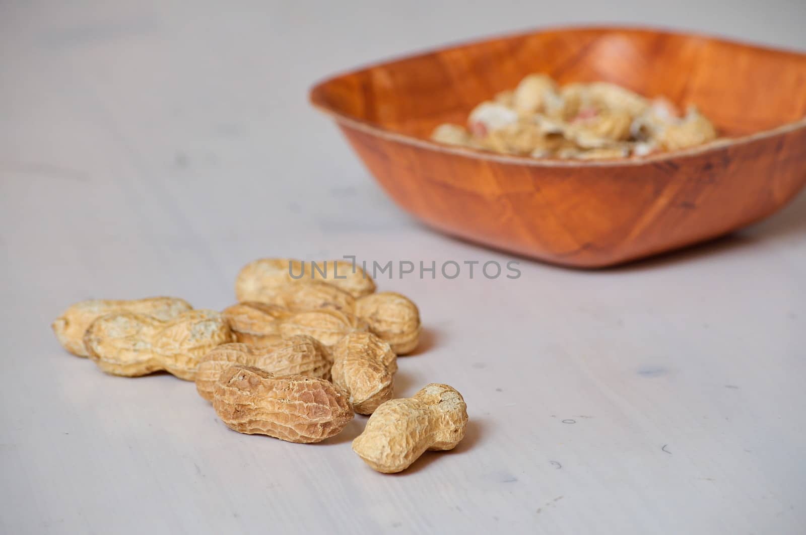 Peanuts in a brown bowl by anderm
