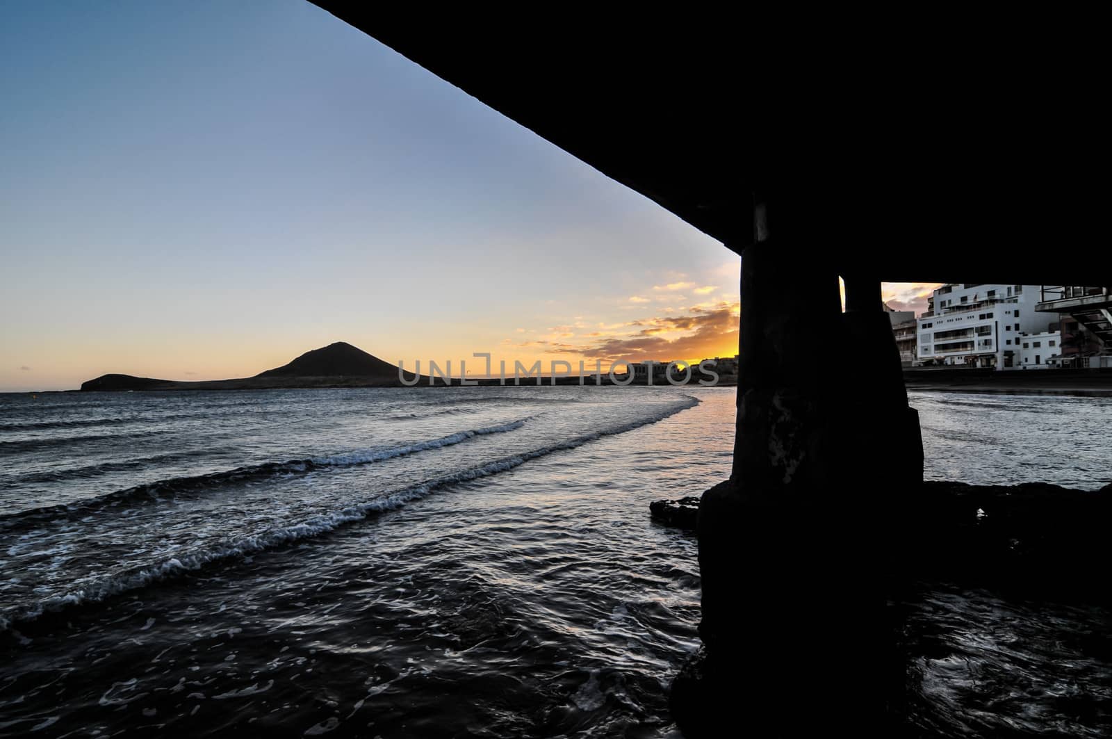 Sunset on the Atlantic Ocean with a Mountain in Background El Medano Tenerife Canary Islands Spain