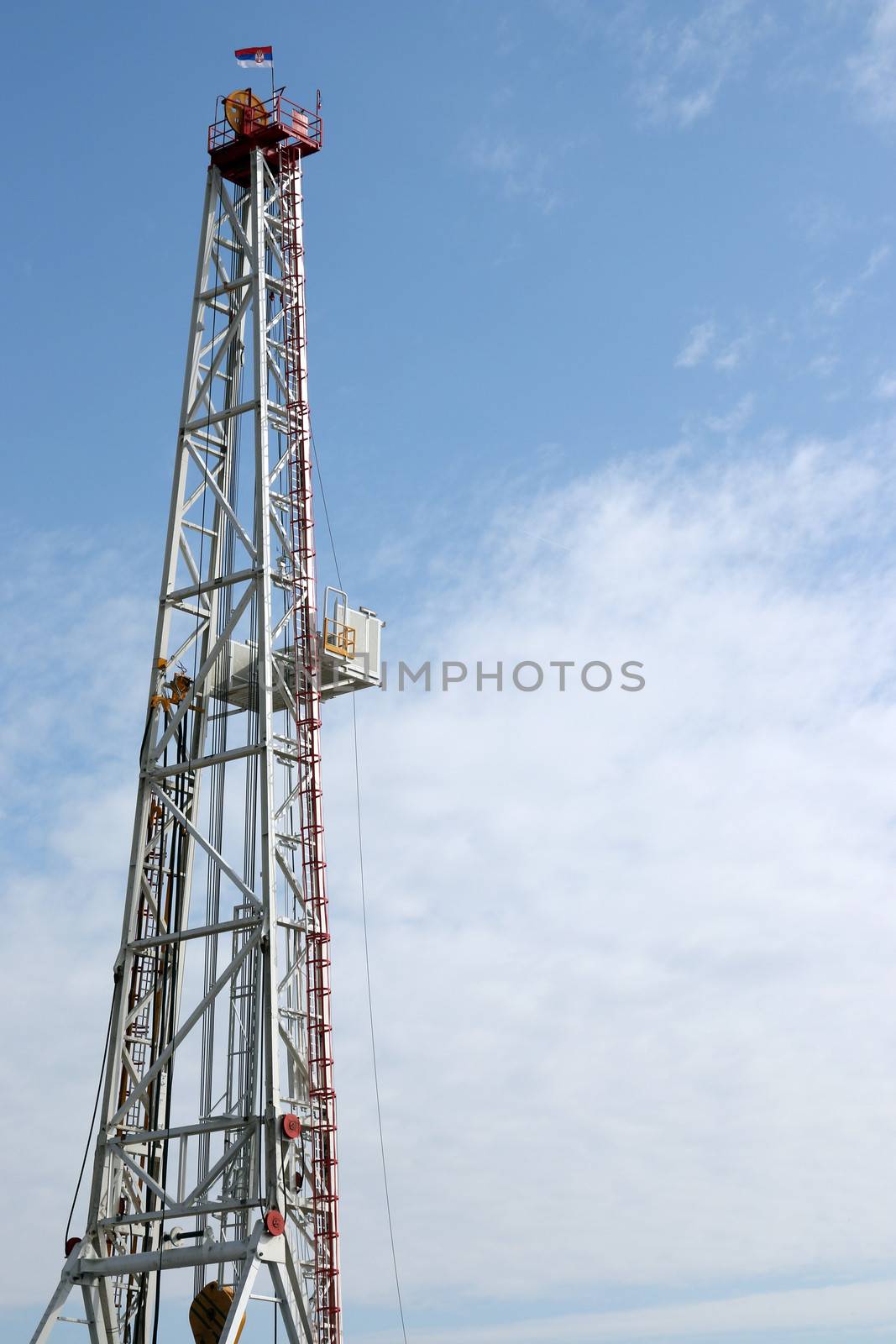 oil drilling rig tower on blue sky