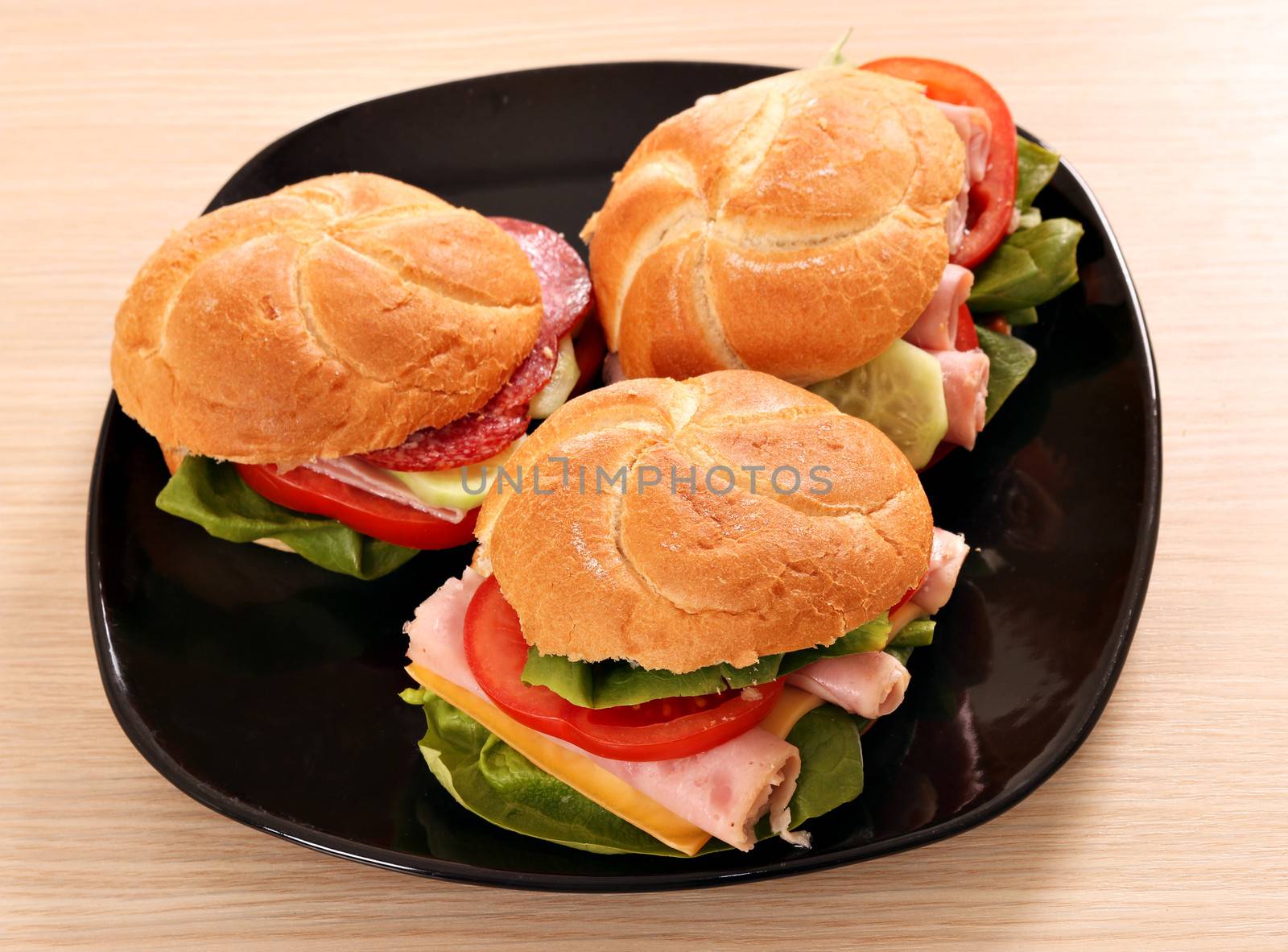 sandwiches on black dish fast food by goce