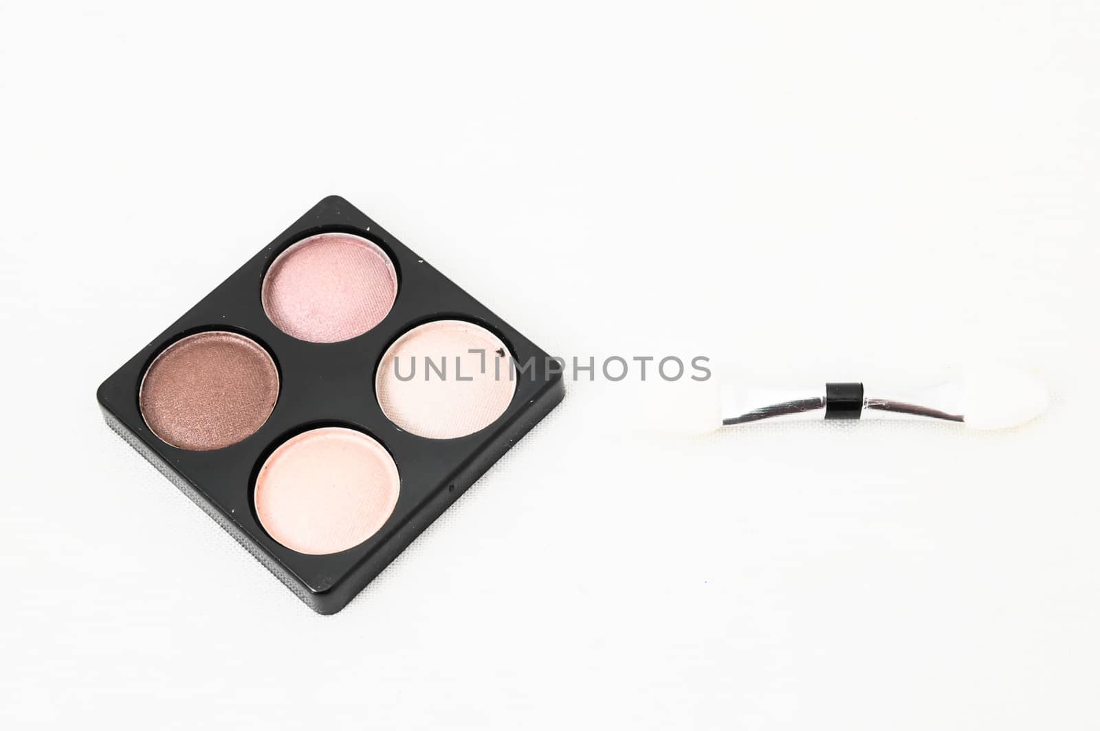 Make-up Palette Of Colorfully Eyeshadows Over White Background