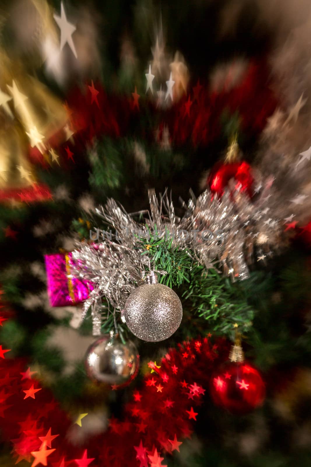 Christmas tree decoration with, lights, garland, tinsel and christmas ball