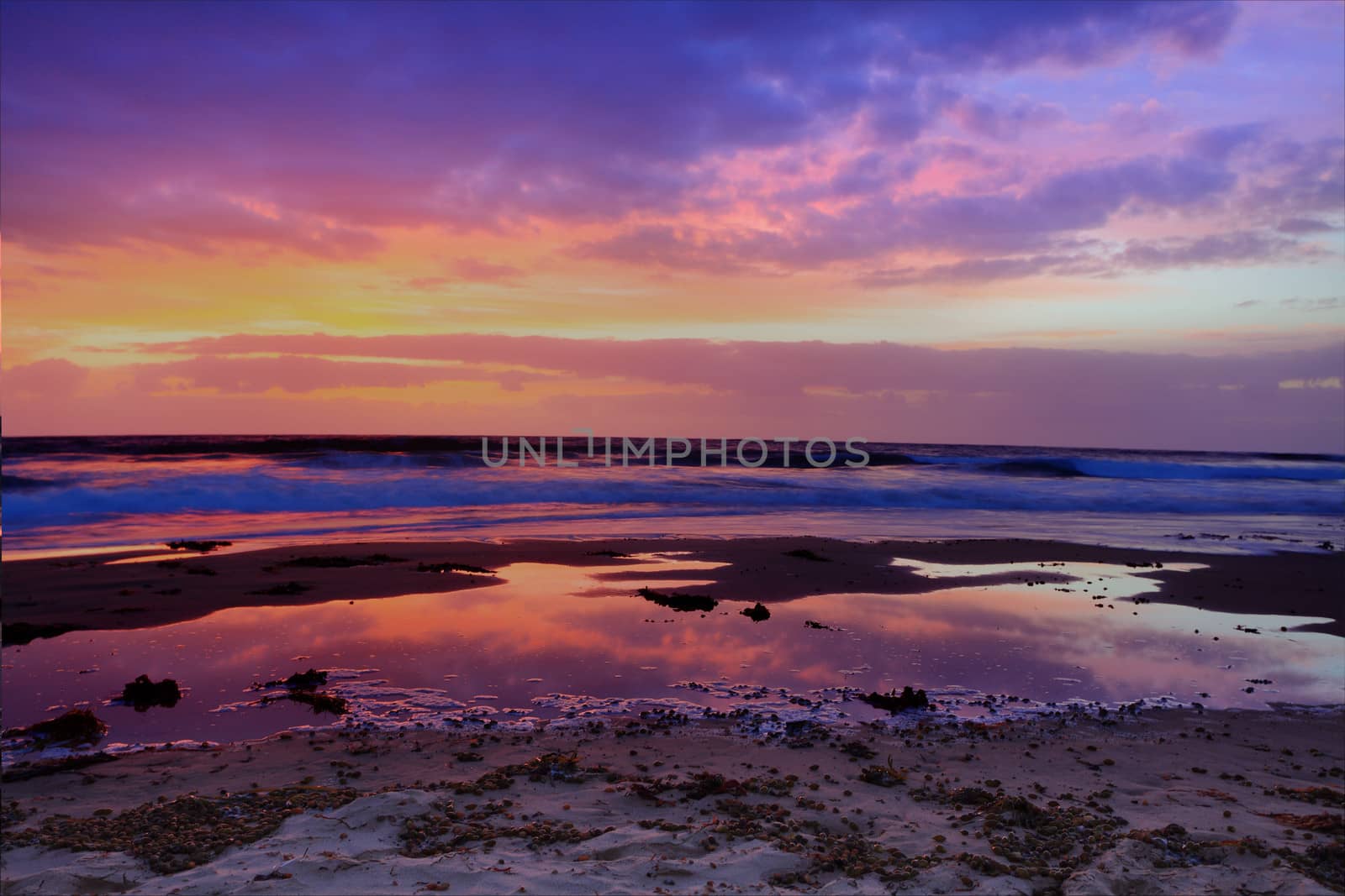 Red dawn at The Entrance, the sky bursts into rich firery colours.  NSW Australia.