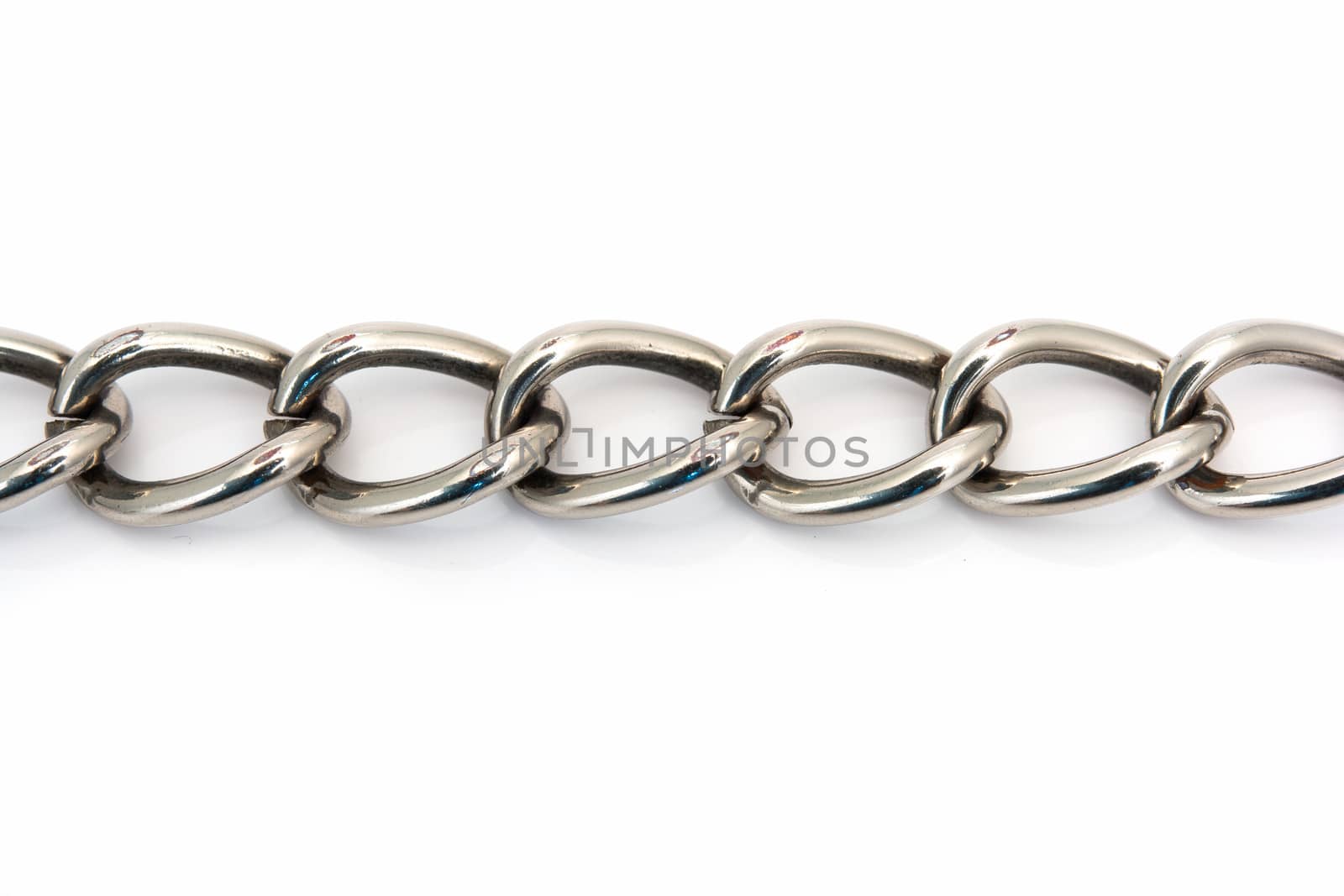 closeup of a metal chain link segment on white background