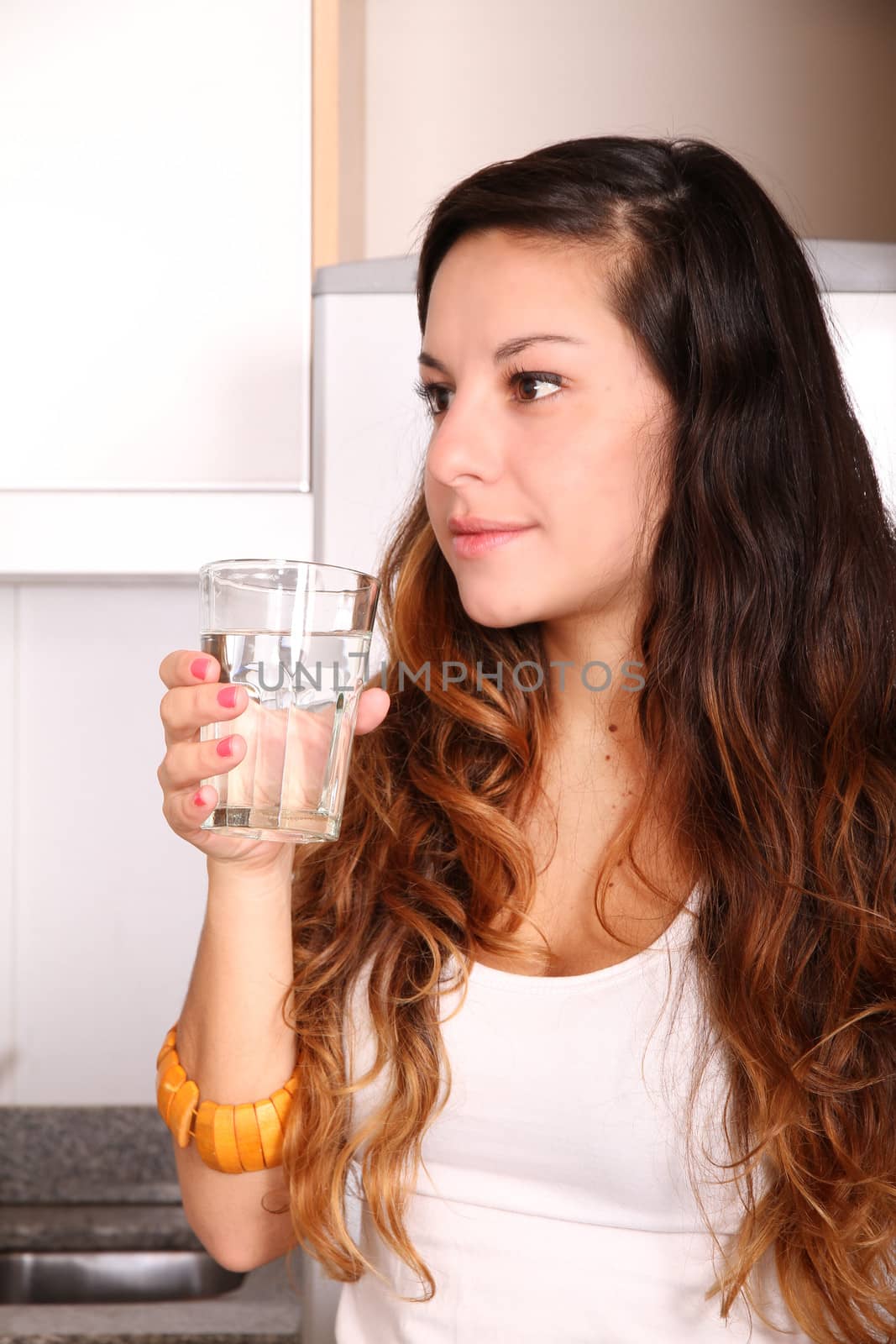 Young woman drinking water by Spectral