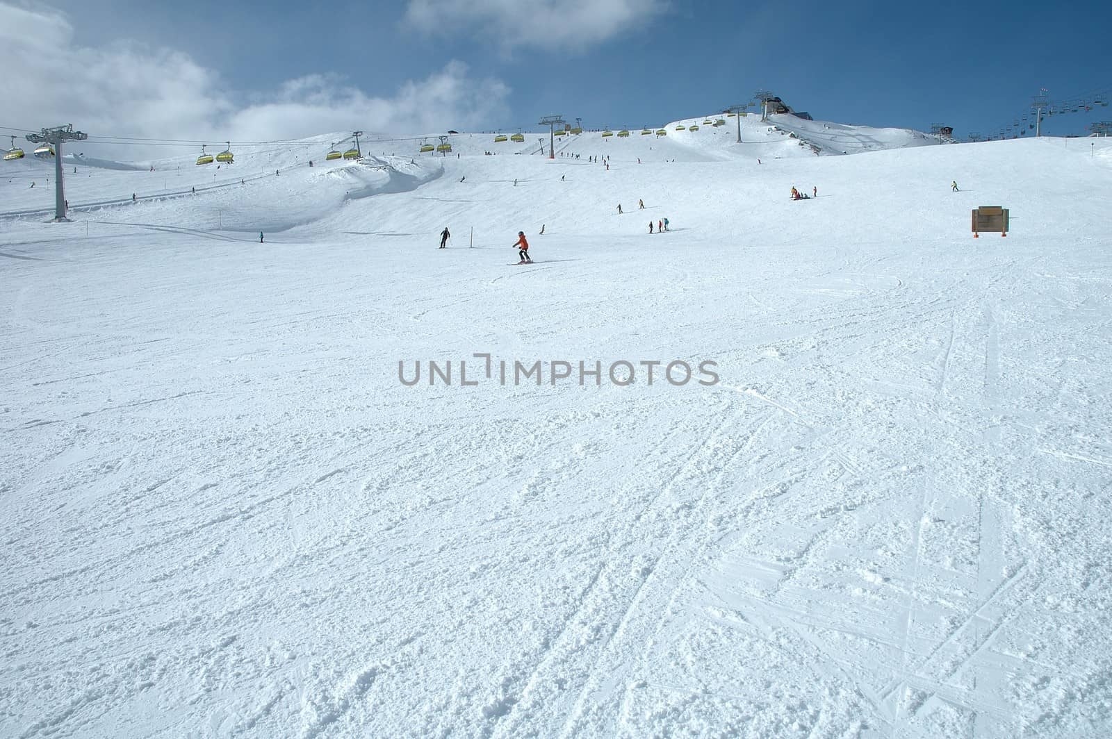 Ski slope and skiers in Austria nearby Kaltenbach in Zillertal valley