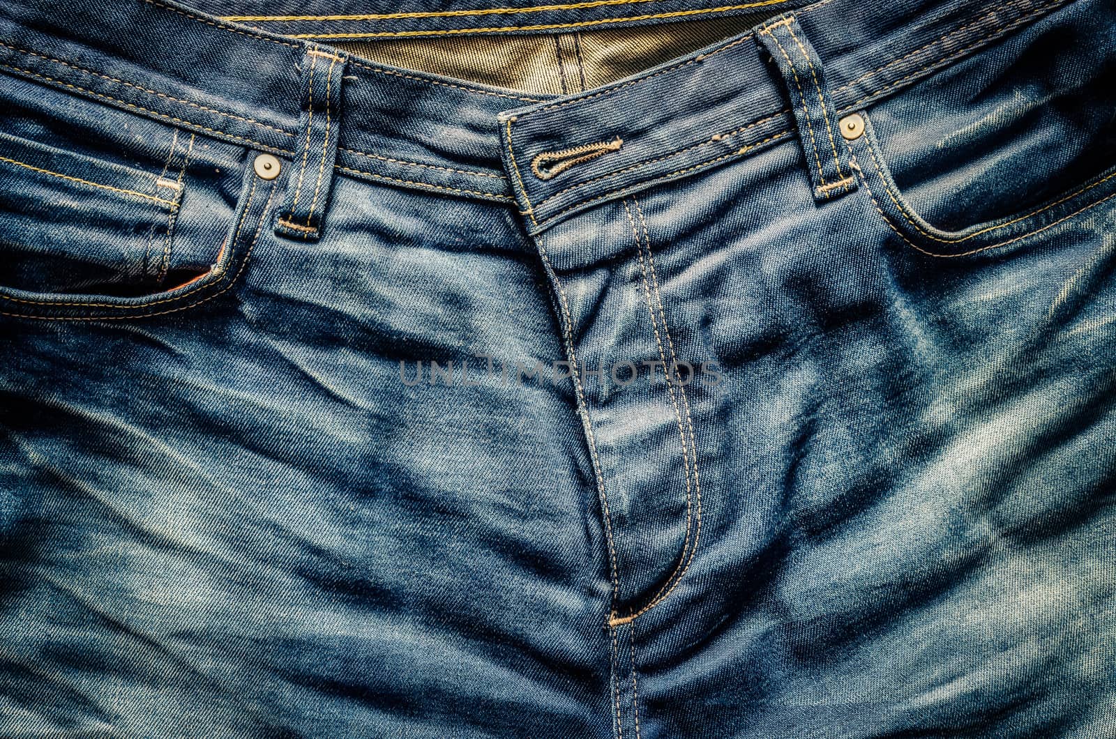 Detail of nice blue jeans in old looking vintage style